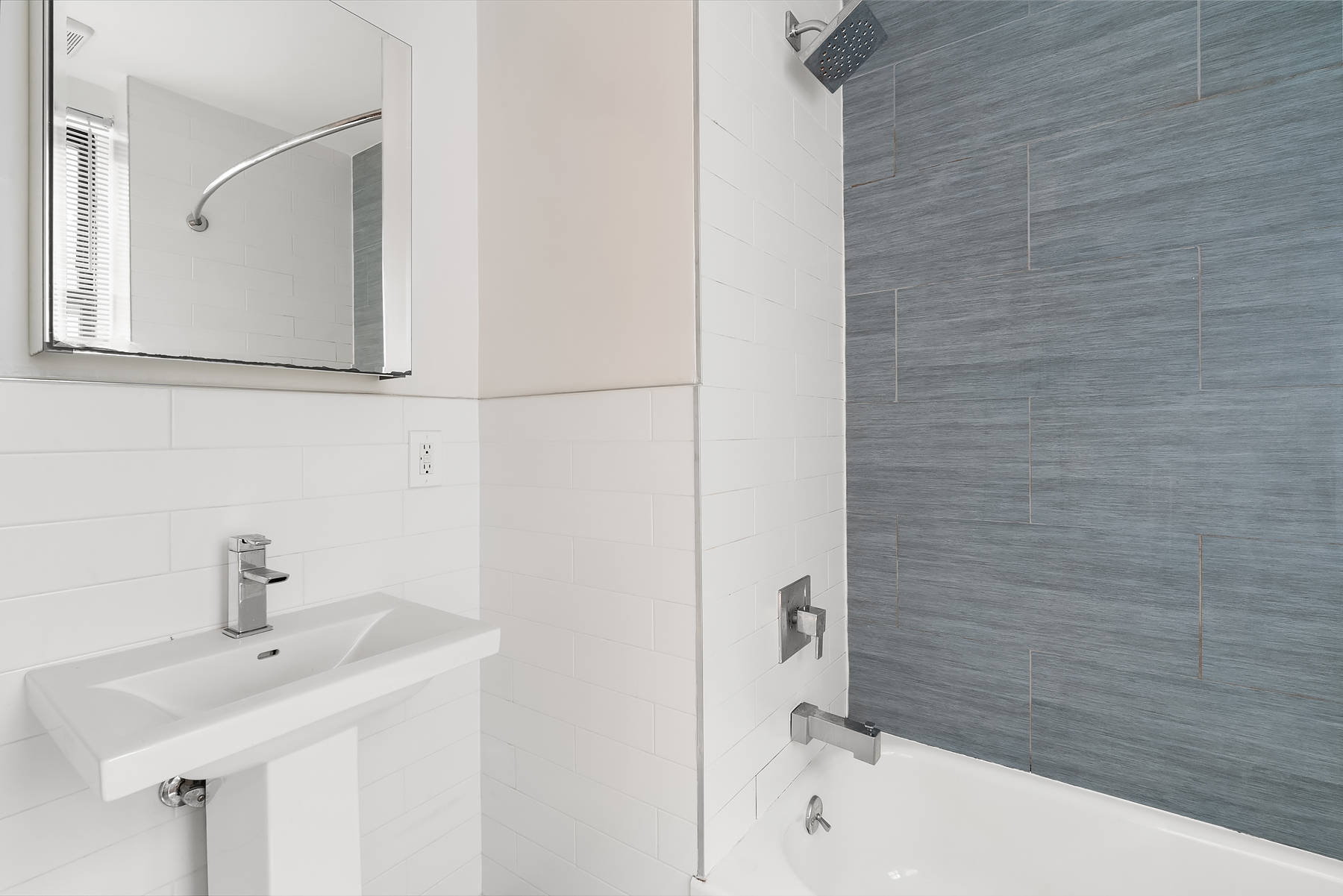 143 West 4th Street, Unit 2FE Manhattan, NY 10012 - Photo 3 of 4 a bathroom with a sink and mirror