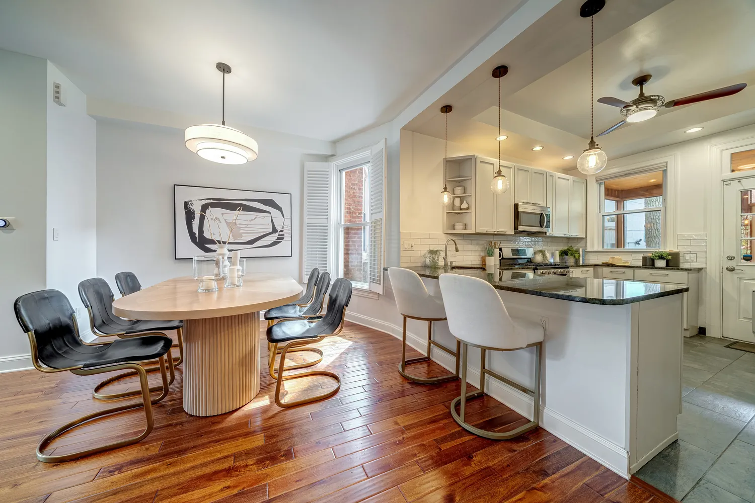 a kitchen with a sink cabinets and wooden floor