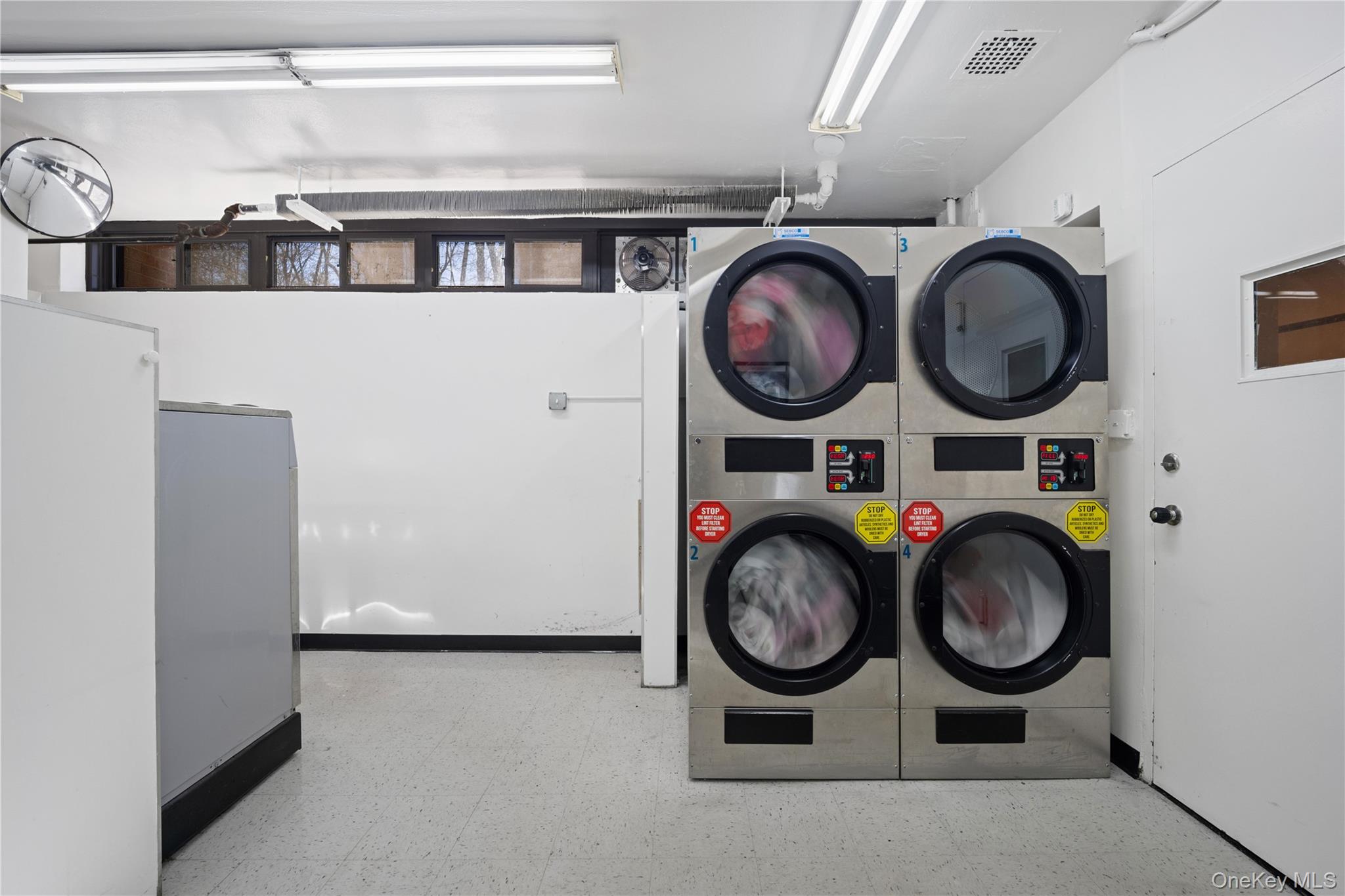 75-34 Bell Boulevard, Unit LD Queens, NY 11364 - Photo 25 of 26 a view of space with washer and dryer