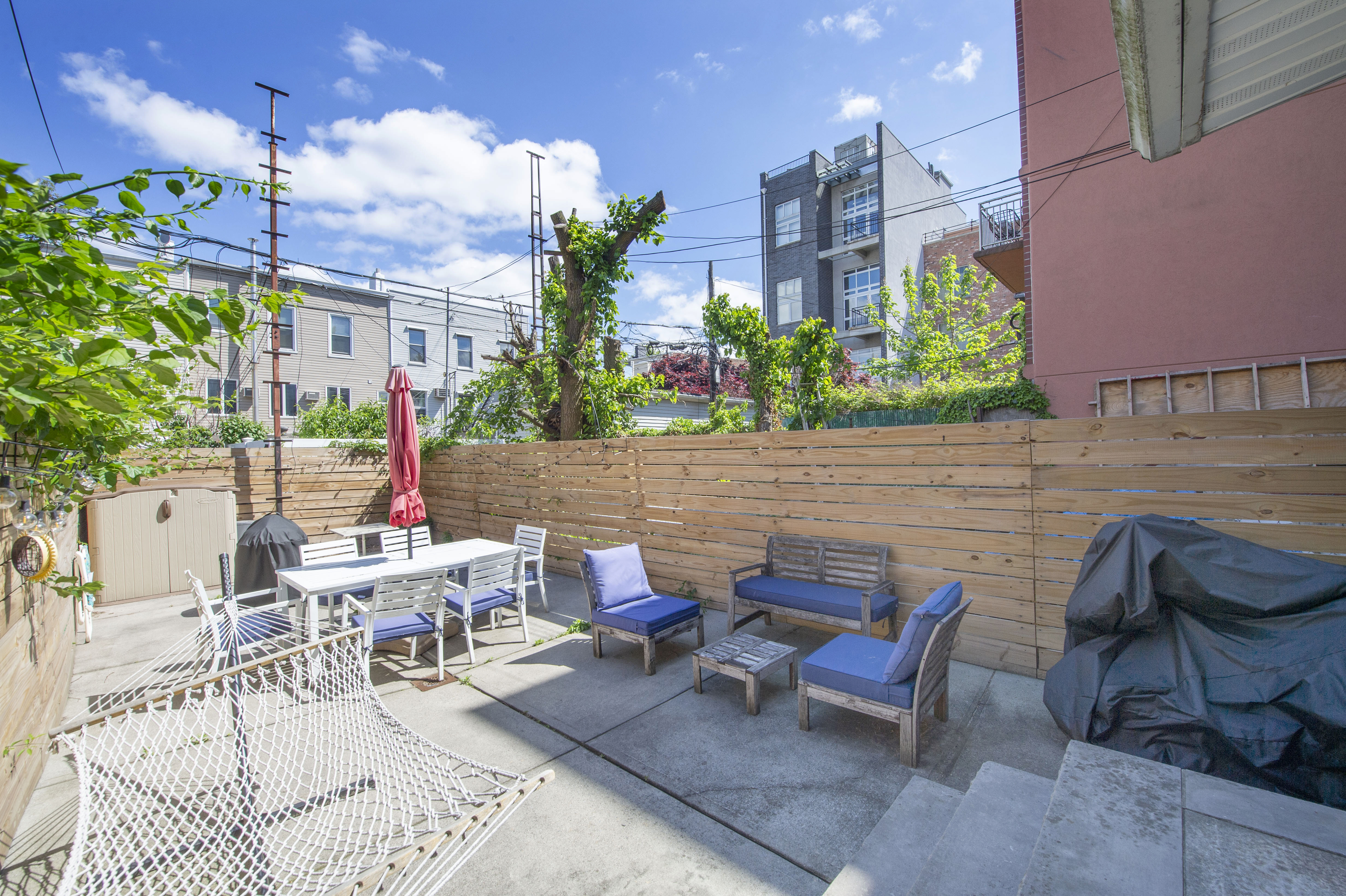 185 A Powers Street, Unit 1 Brooklyn, NY 11211 - Photo 8 of 13 a view of a patio with table and chairs and potted plants