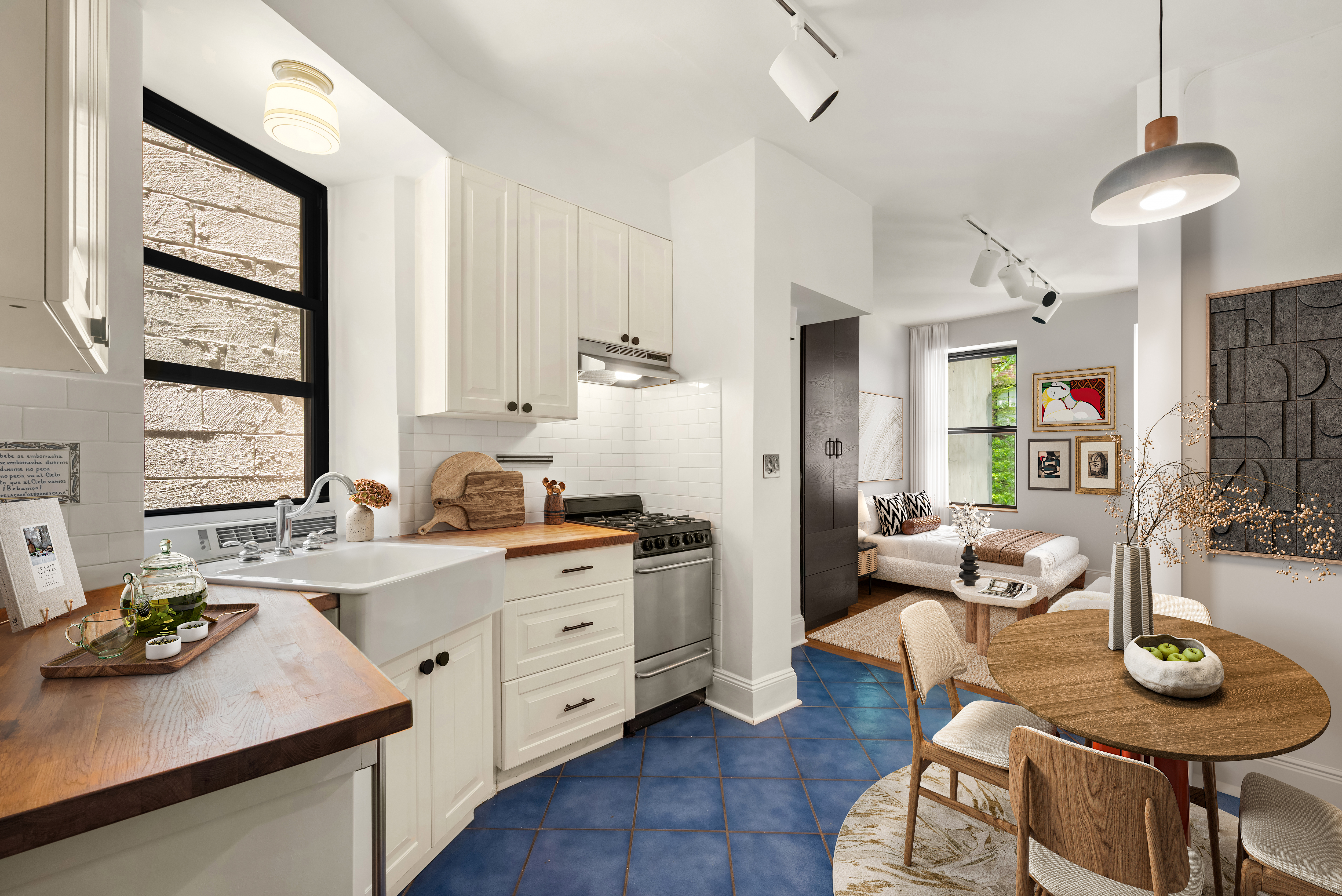a kitchen with stainless steel appliances a stove a table and chairs in it