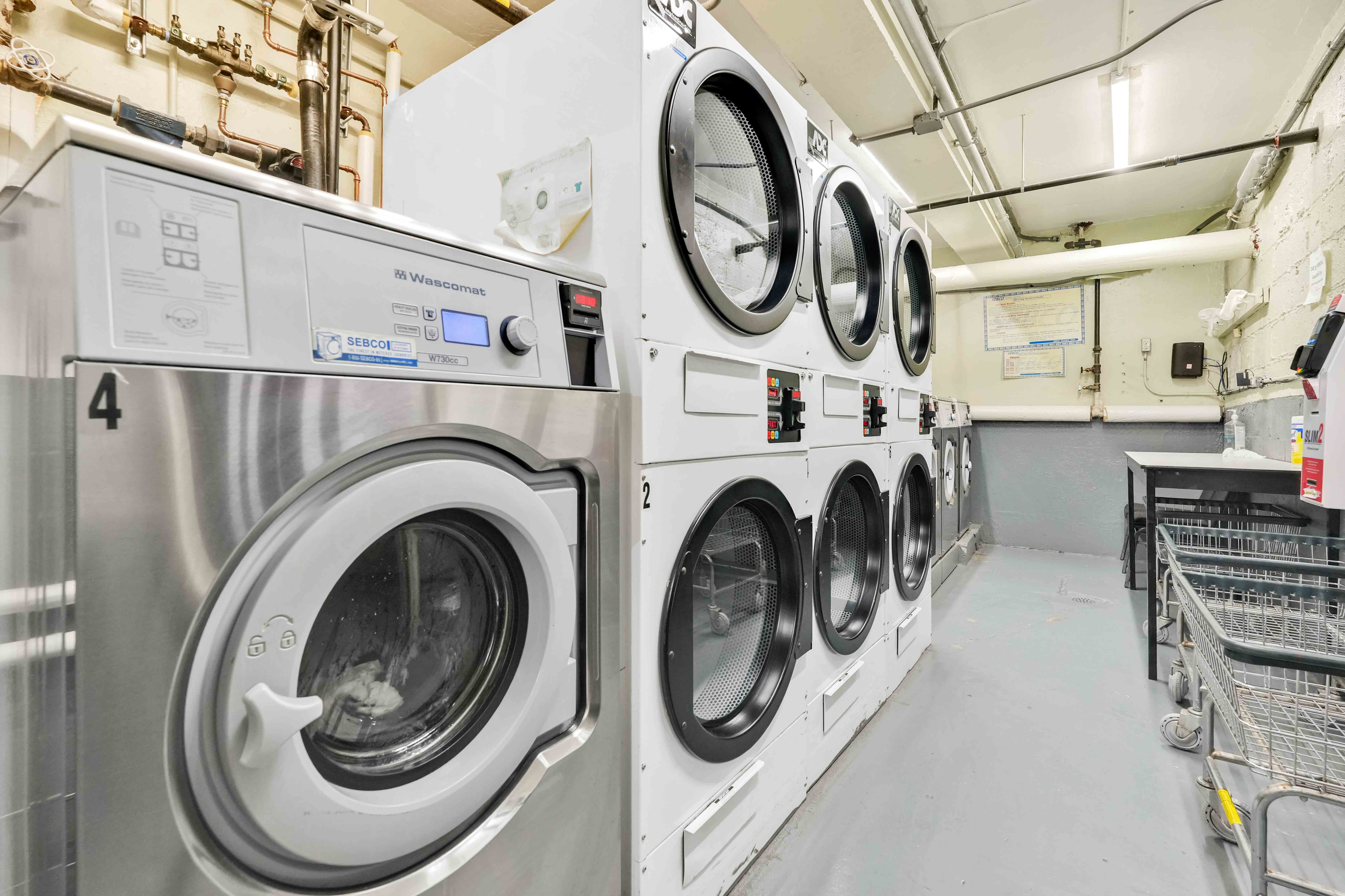 57 Montague Street, Unit 1D Brooklyn, NY 11201 - Photo 12 of 27 a utility room with dryer and washer
