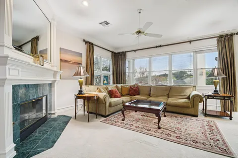 a living room with furniture and a fireplace