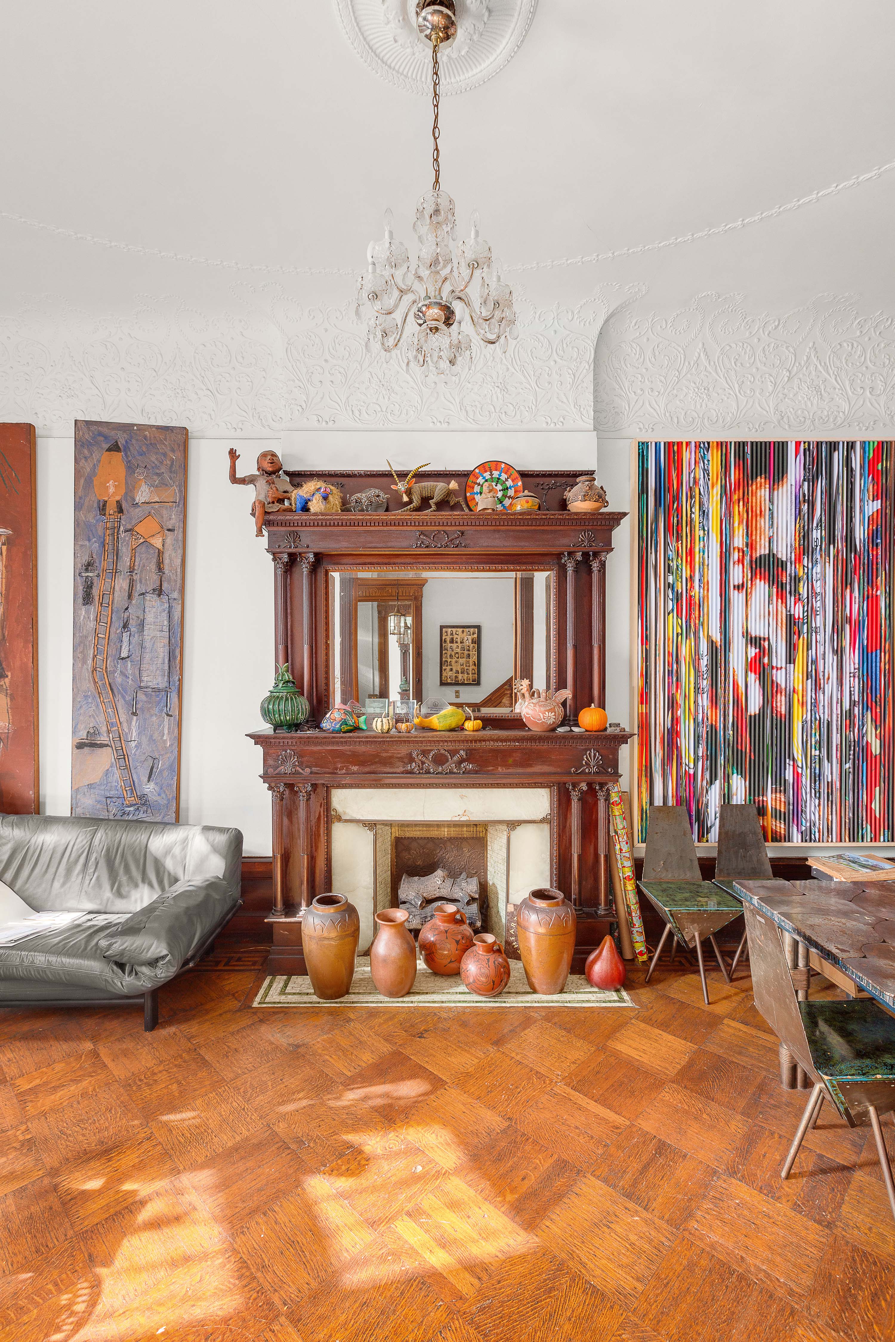 117 West 120th Street Manhattan, NY 10027 - Photo 10 of 31 a living room with furniture and a chandelier