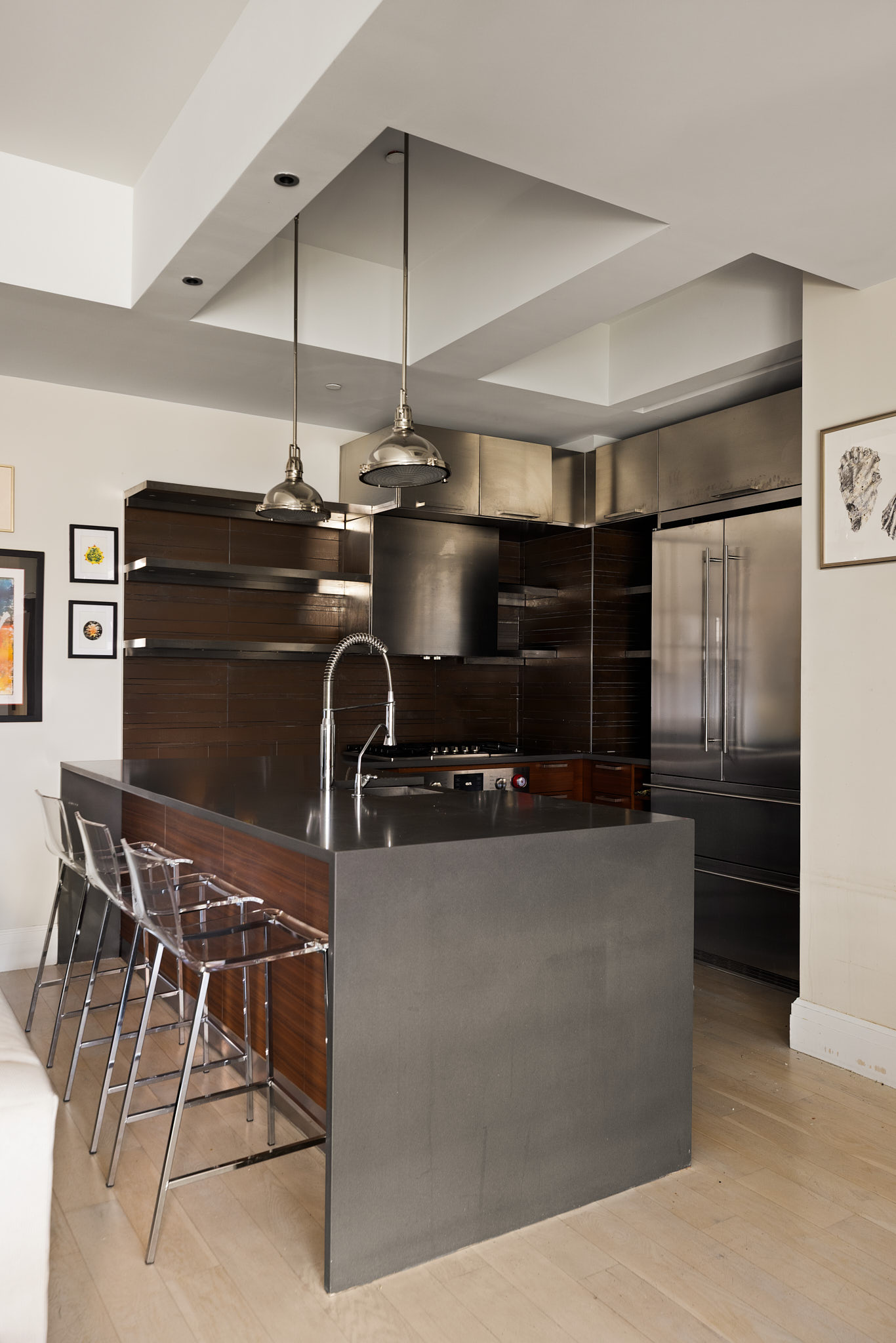 170 South 1st Street, Unit 4B Brooklyn, NY 11211 - Photo 4 of 11 a kitchen with stainless steel appliances granite countertop a sink and a refrigerator