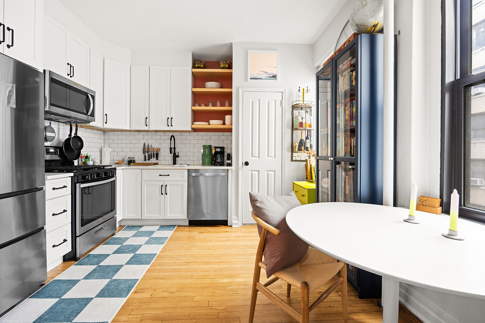 125 Eastern Parkway, Unit 3A Brooklyn, NY 11238 - Photo 3 of 15 a kitchen with stainless steel appliances kitchen island granite countertop a sink a stove and refrigerator
