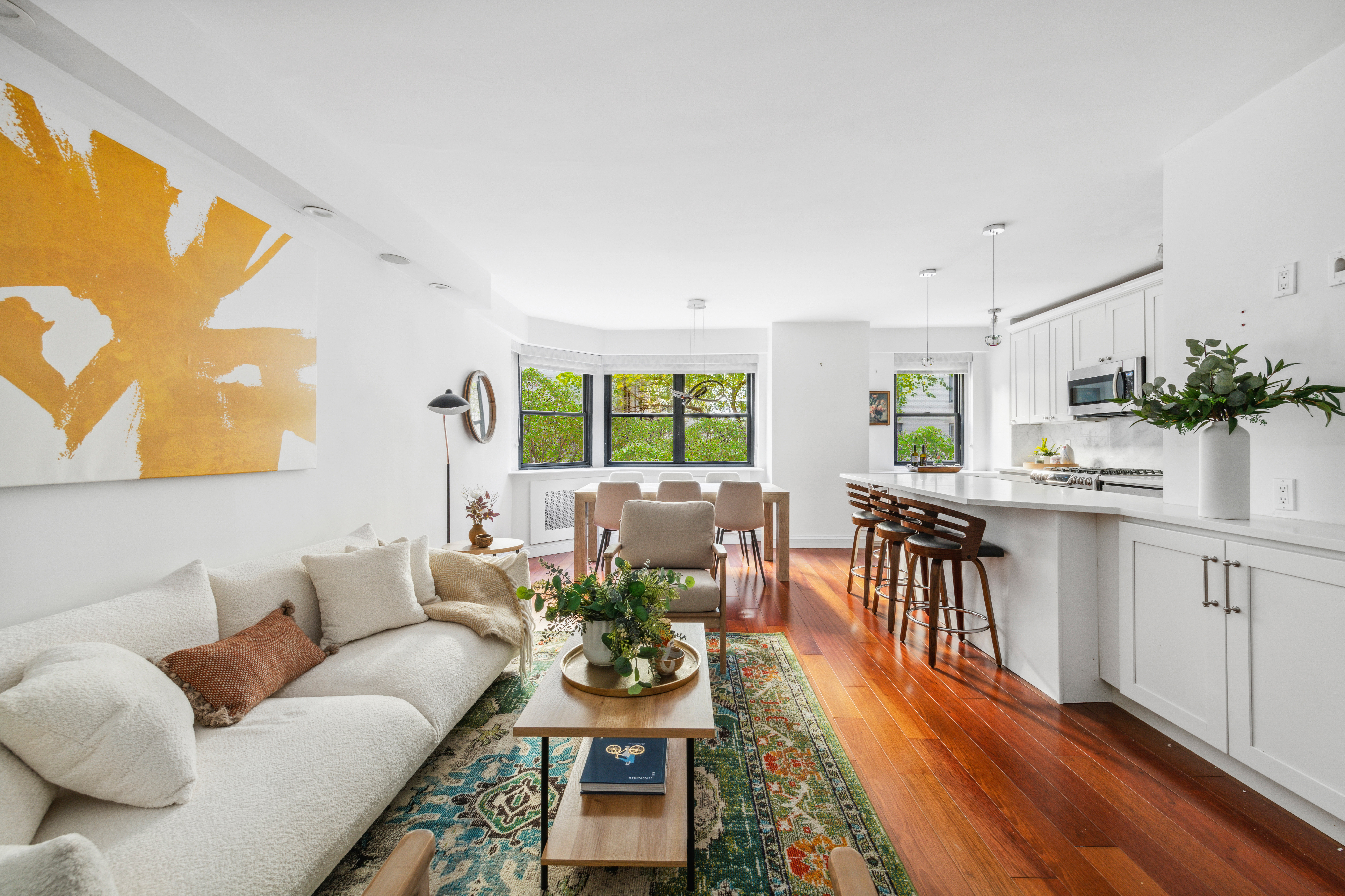 176 East 77th Street, Unit 2K Manhattan, NY 10075 - Photo 2 of 17 a living room with furniture and wooden floor