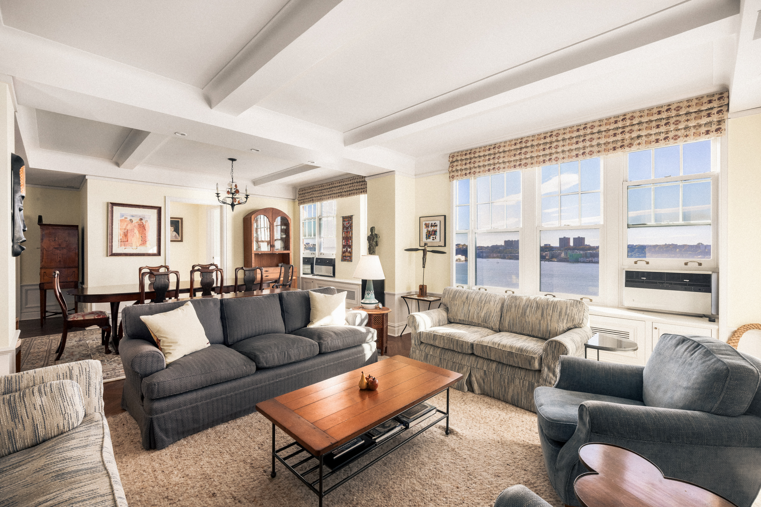 33 Riverside Drive, Unit 13AB Manhattan, NY 10023 - Photo 5 of 19 a living room with furniture and a large window