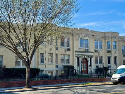 a front view of a building with street view