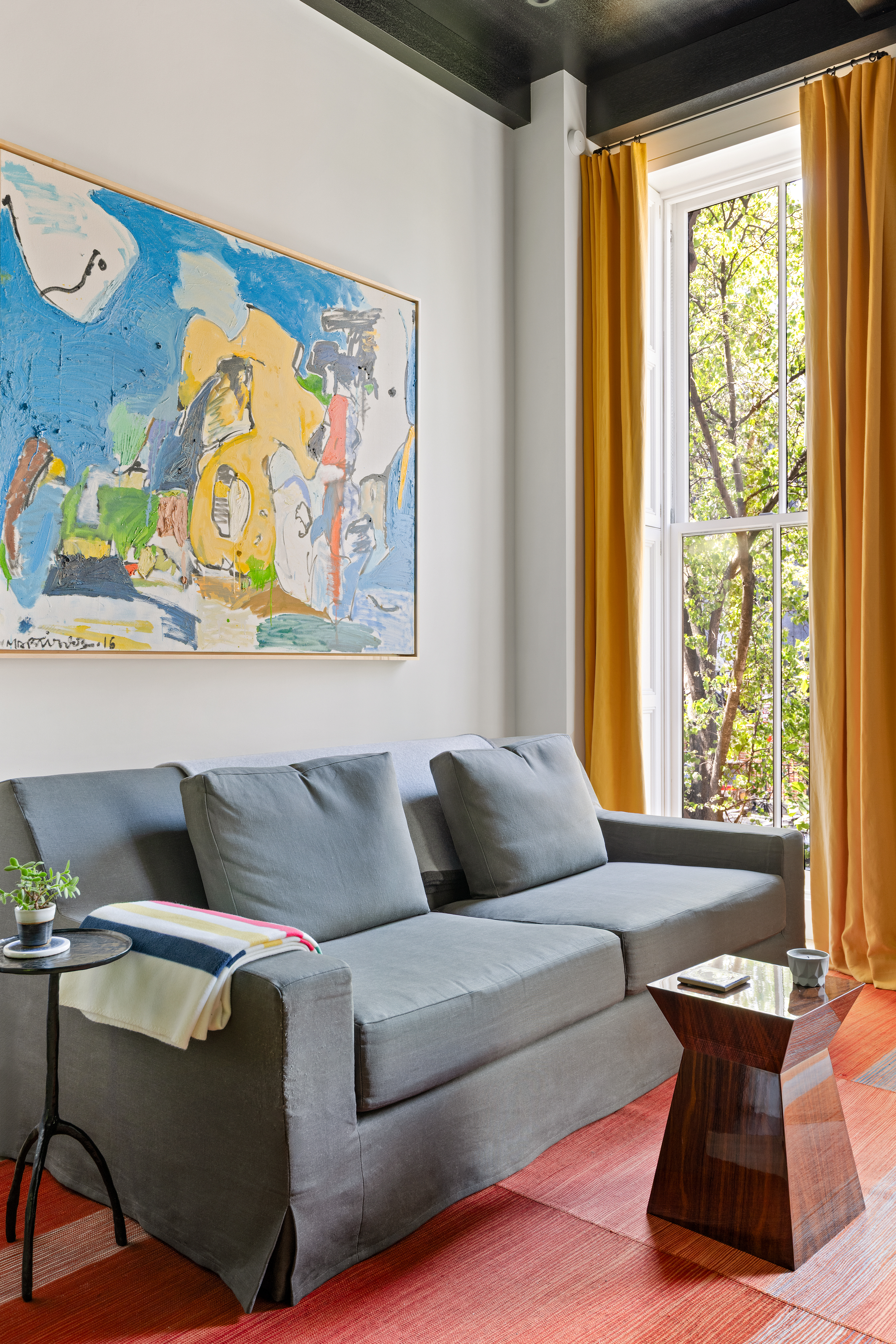 315 Adelphi Street Brooklyn, NY 11205 - Photo 10 of 31 a living room with furniture and a large window