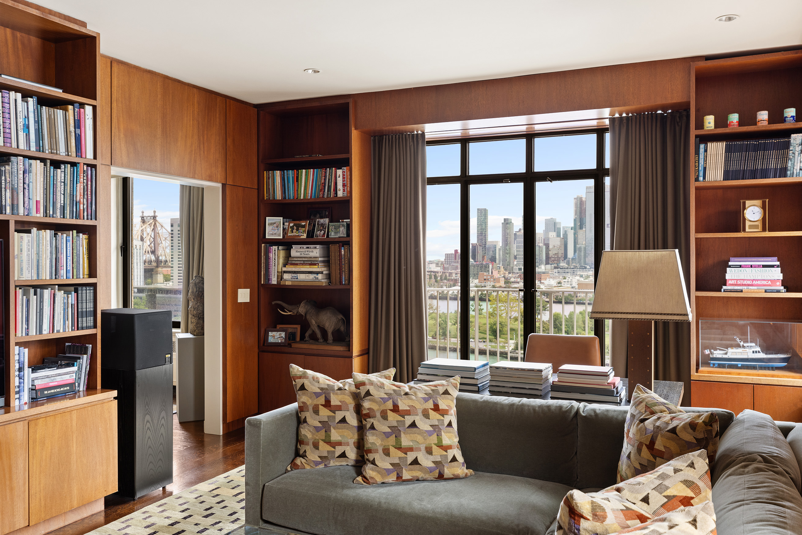 435 East 52nd Street, Unit 11A Manhattan, NY 10022 - Photo 6 of 21 a living room with furniture and a large window