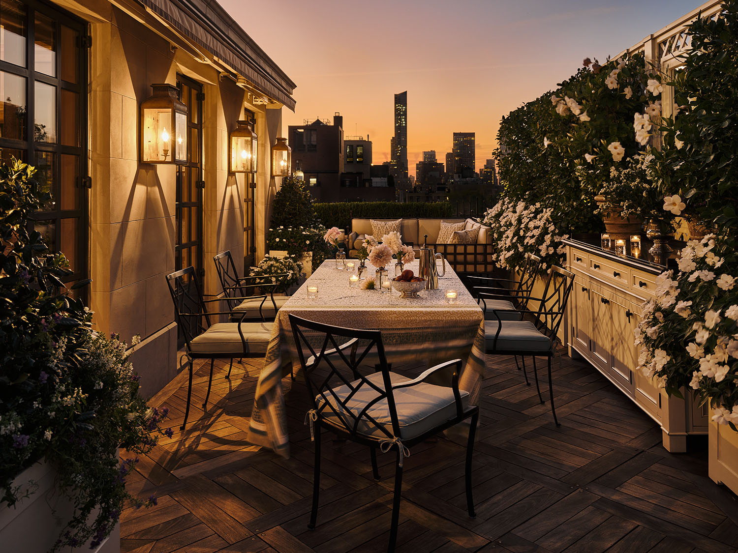 620 Park Avenue, Unit 14 Manhattan, NY 10065 - Photo 4 of 32 a view of a patio with table and chairs and potted plants with wooden floor and fence