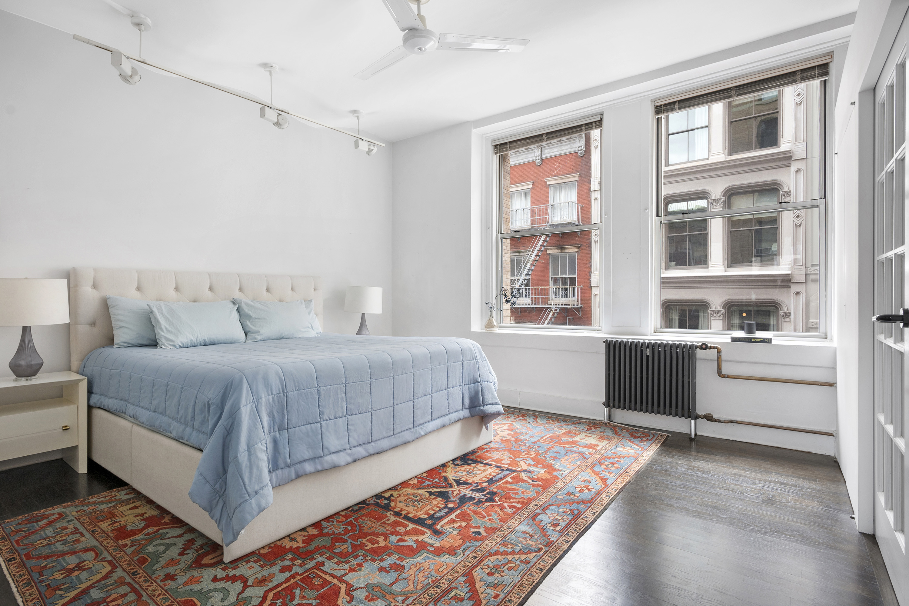 45 Lispenard Street, Unit 3E Manhattan, NY 10013 - Photo 4 of 9 a bedroom with a large bed and a window