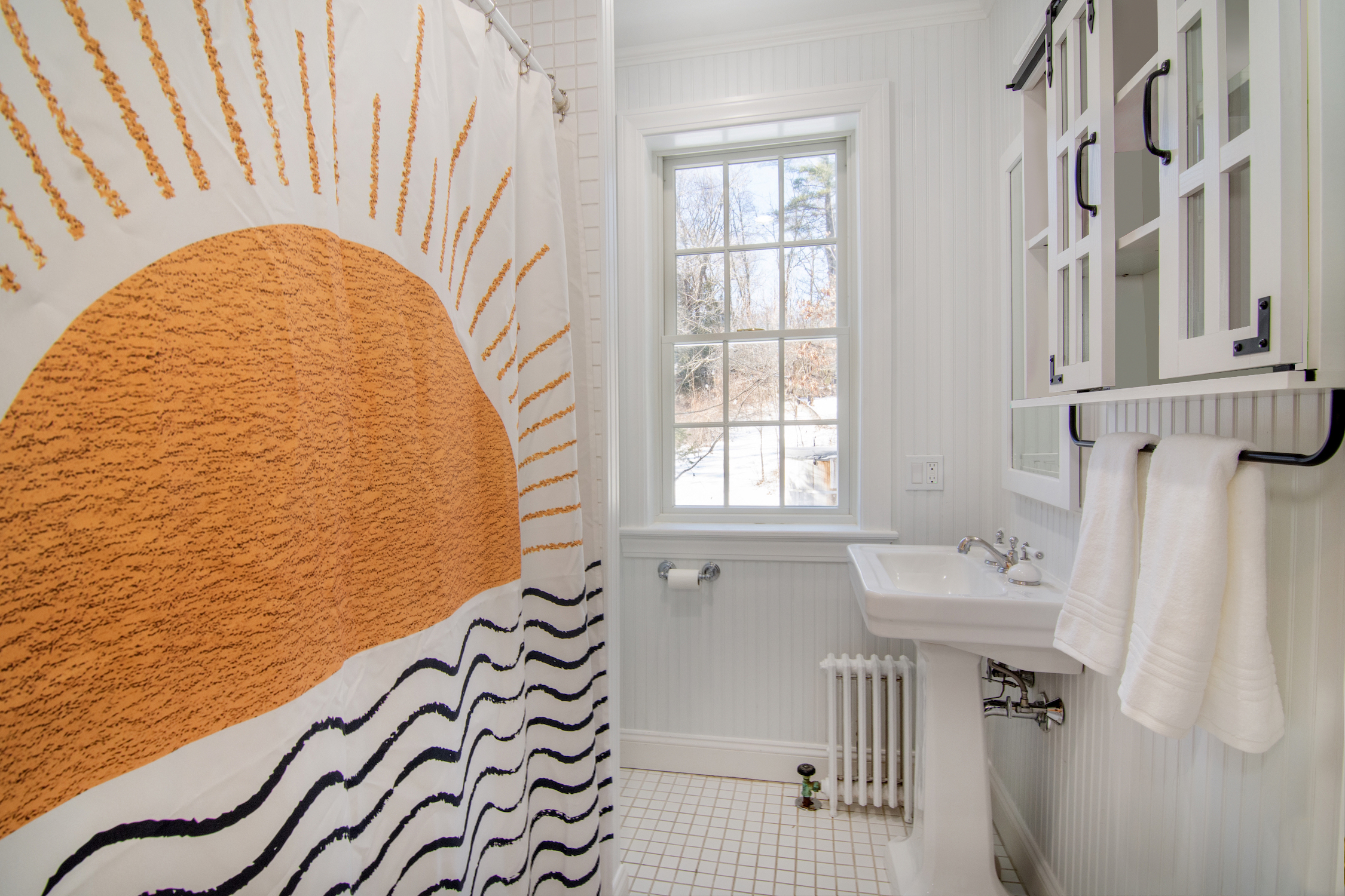 41 Harris Road Katonah, NY 10536 - Photo 23 of 48 a bathroom with a sink a mirror and a shower