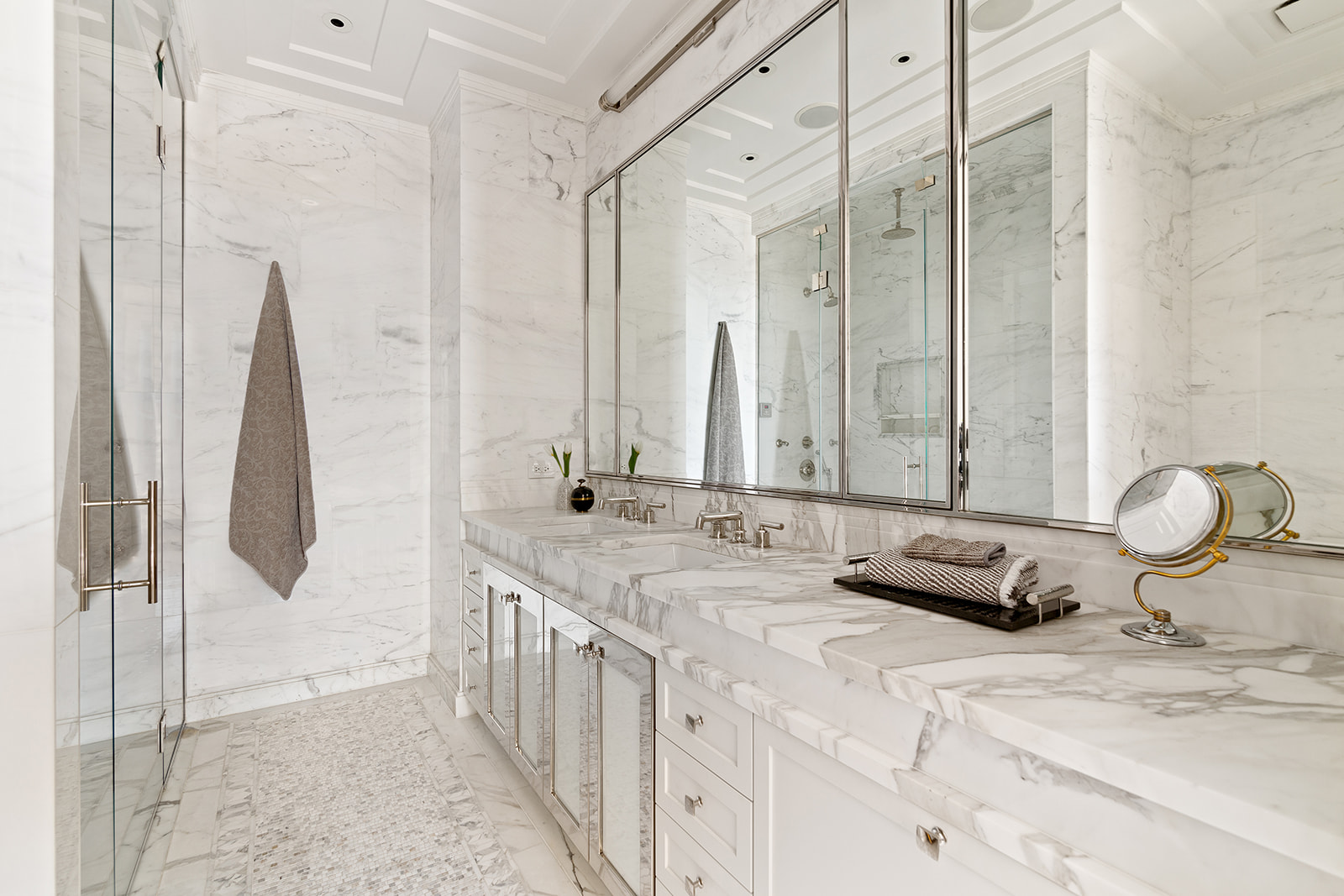212 West 18th Street, Unit 9C Manhattan, NY 10011 - Photo 7 of 10 a bathroom with a double vanity sink and a mirror