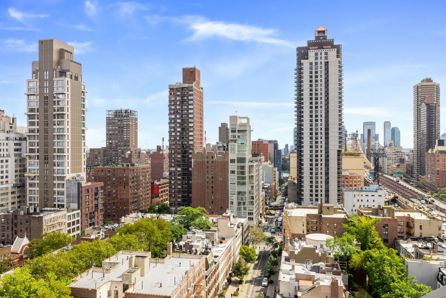 a view of a city with tall buildings