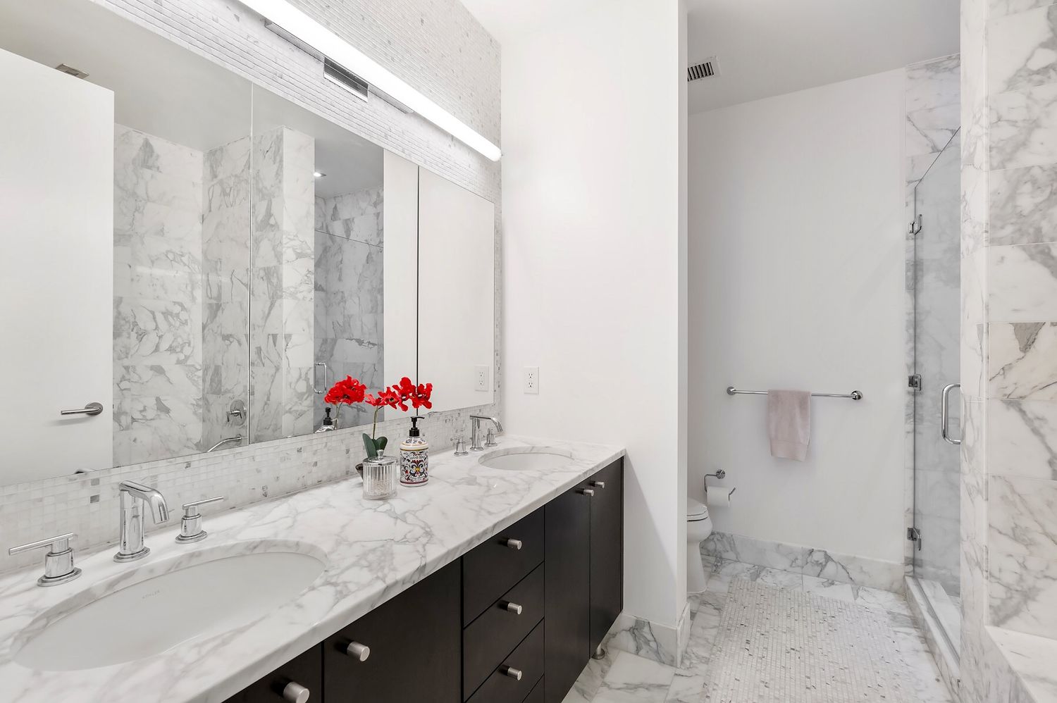 46-30 Center Boulevard, Unit 1102 Queens, NY 11109 - Photo 8 of 26 a bathroom with a granite countertop sink and a mirror