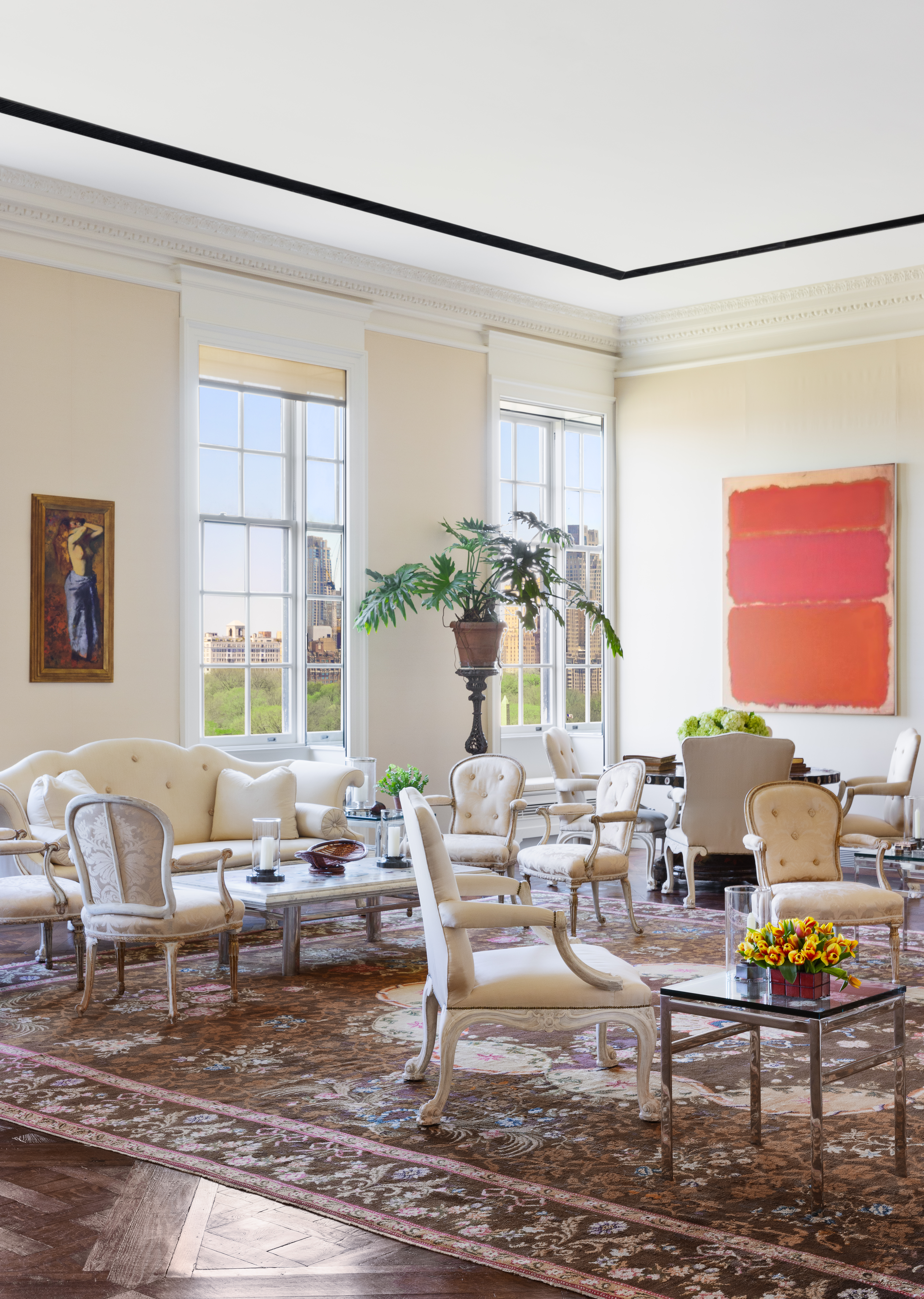 960 5th Avenue Manhattan, NY 10075 - Photo 4 of 13 a living room with furniture and a large window