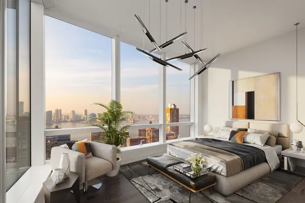 a living room with furniture and floor to ceiling windows