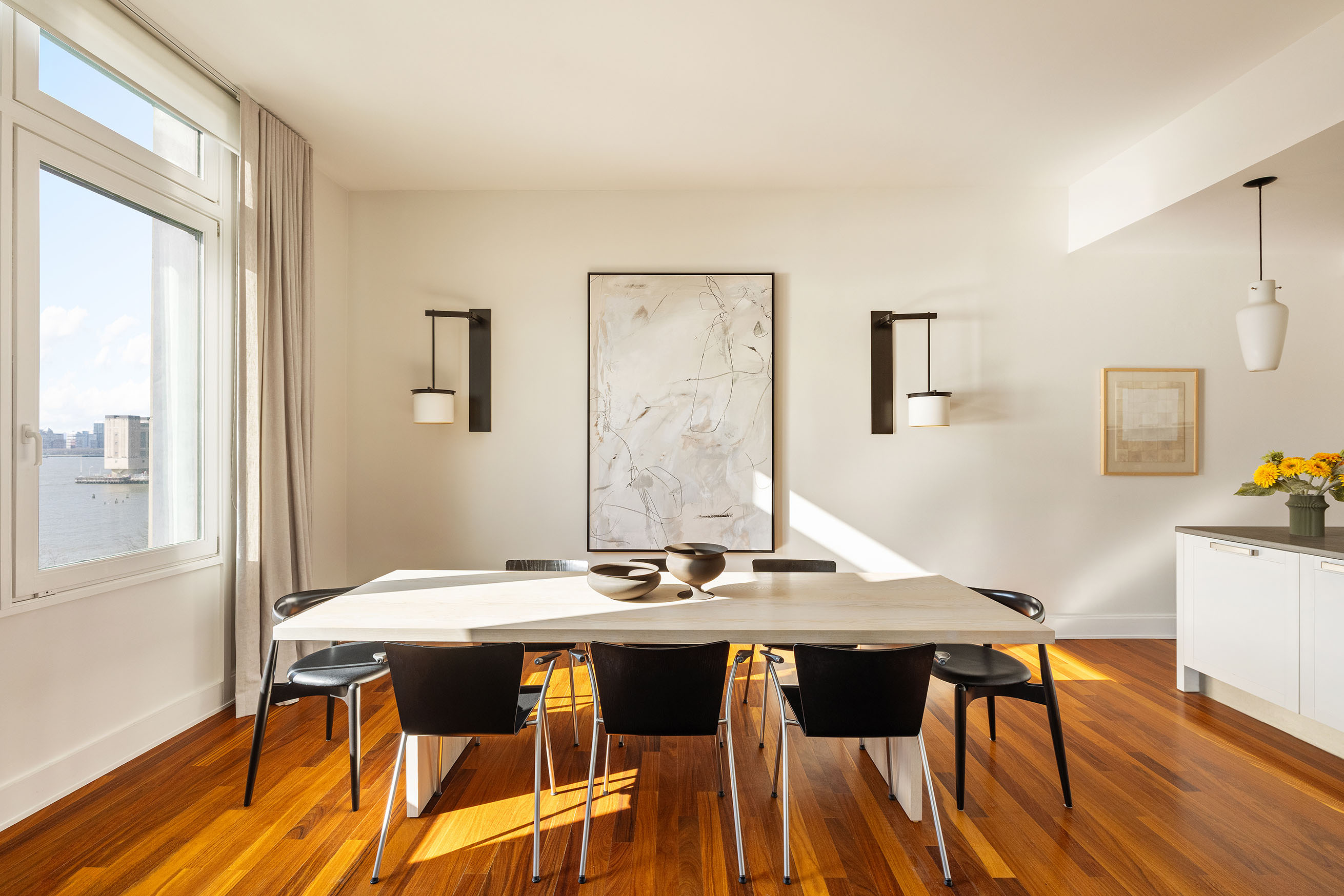 92 Laight Street, Unit 6D Manhattan, NY 10013 - Photo 3 of 15 a view of a dining room with furniture and wooden floor