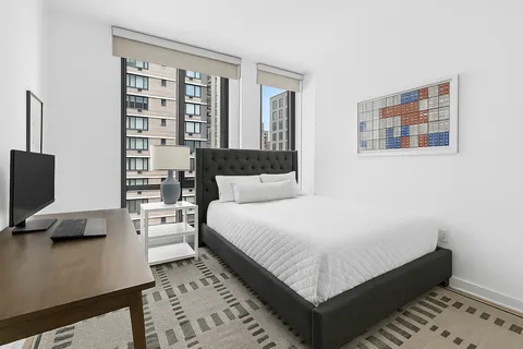 a bed room with a bed and a couch