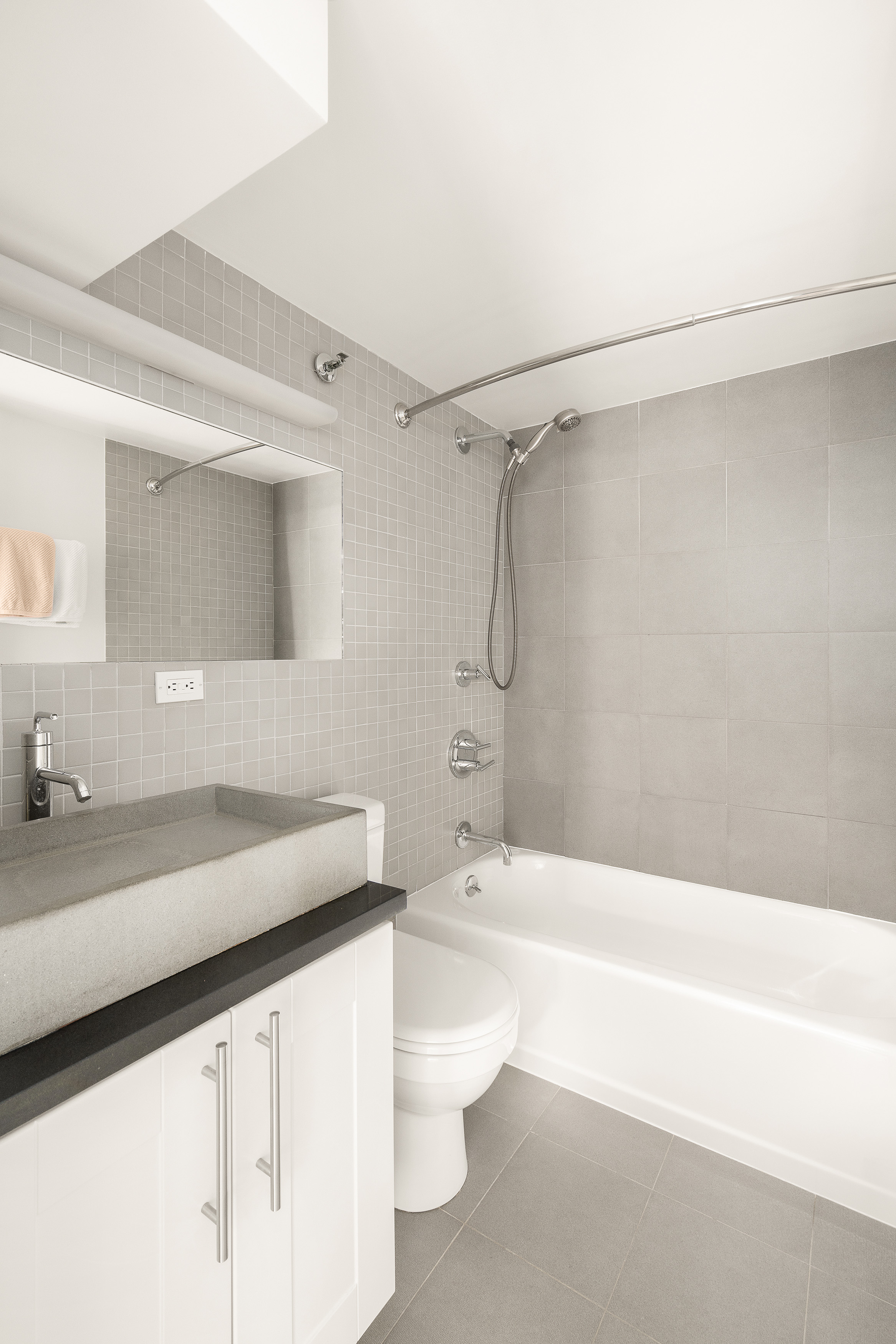 77 Bleecker Street, Unit 618 Manhattan, NY 10012 - Photo 5 of 6 a bathroom with a sink a toilet and a bathtub