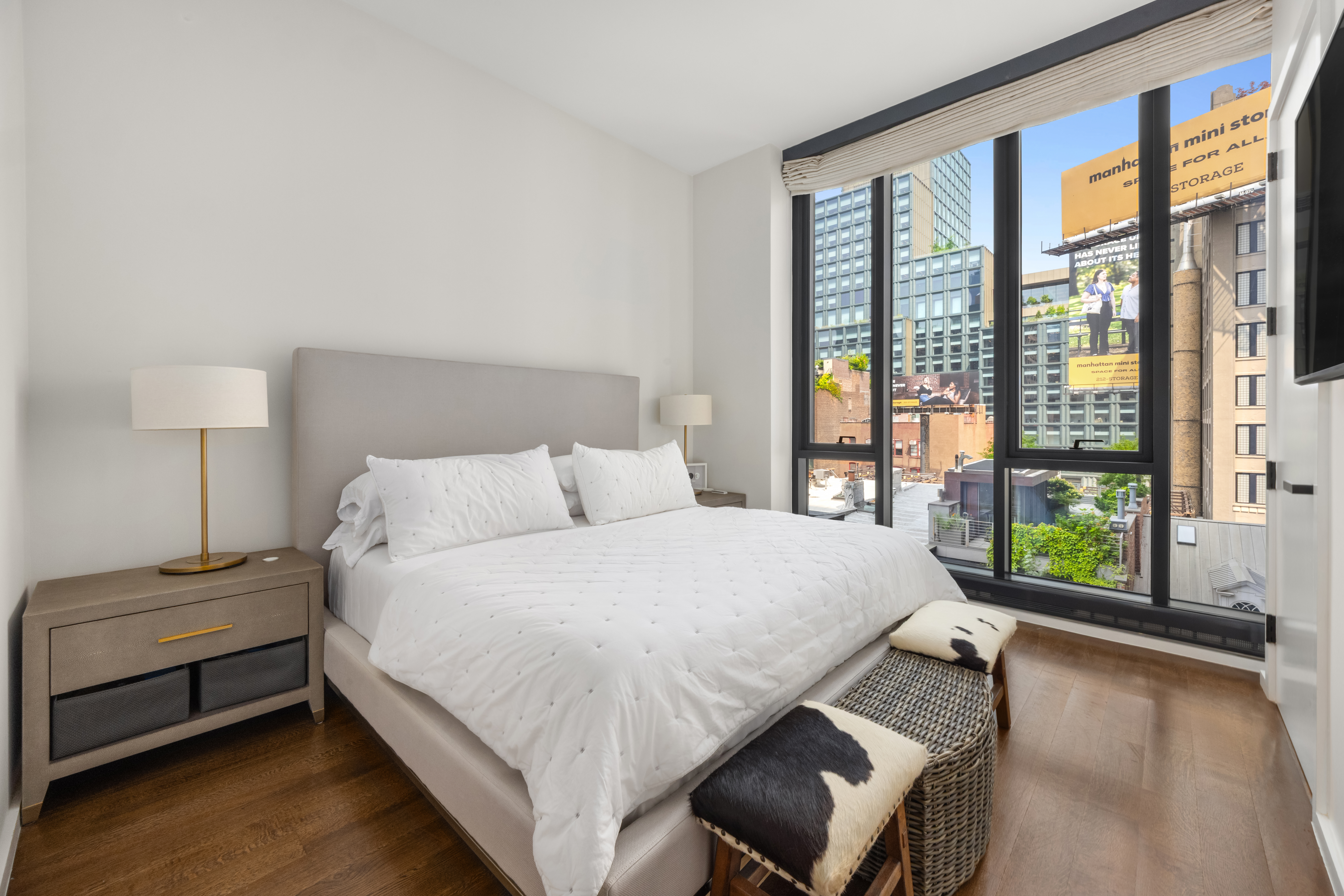 570 Broome Street, Unit 6A Manhattan, NY 10013 - Photo 7 of 17 a bedroom with a bed and a large window