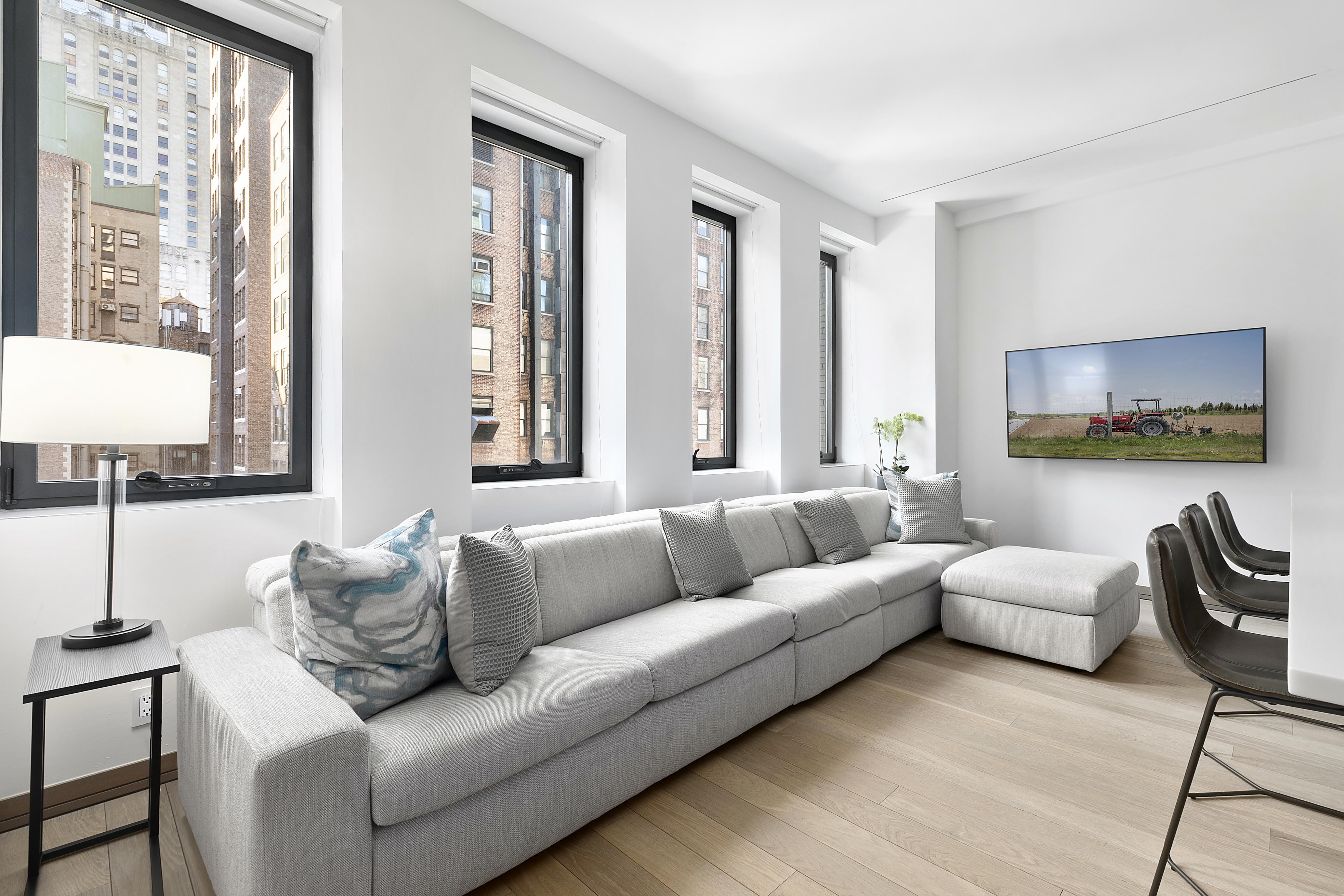88 Lexington Avenue, Unit 802 Manhattan, NY 10016 - Photo 3 of 22 a living room with furniture and a large window