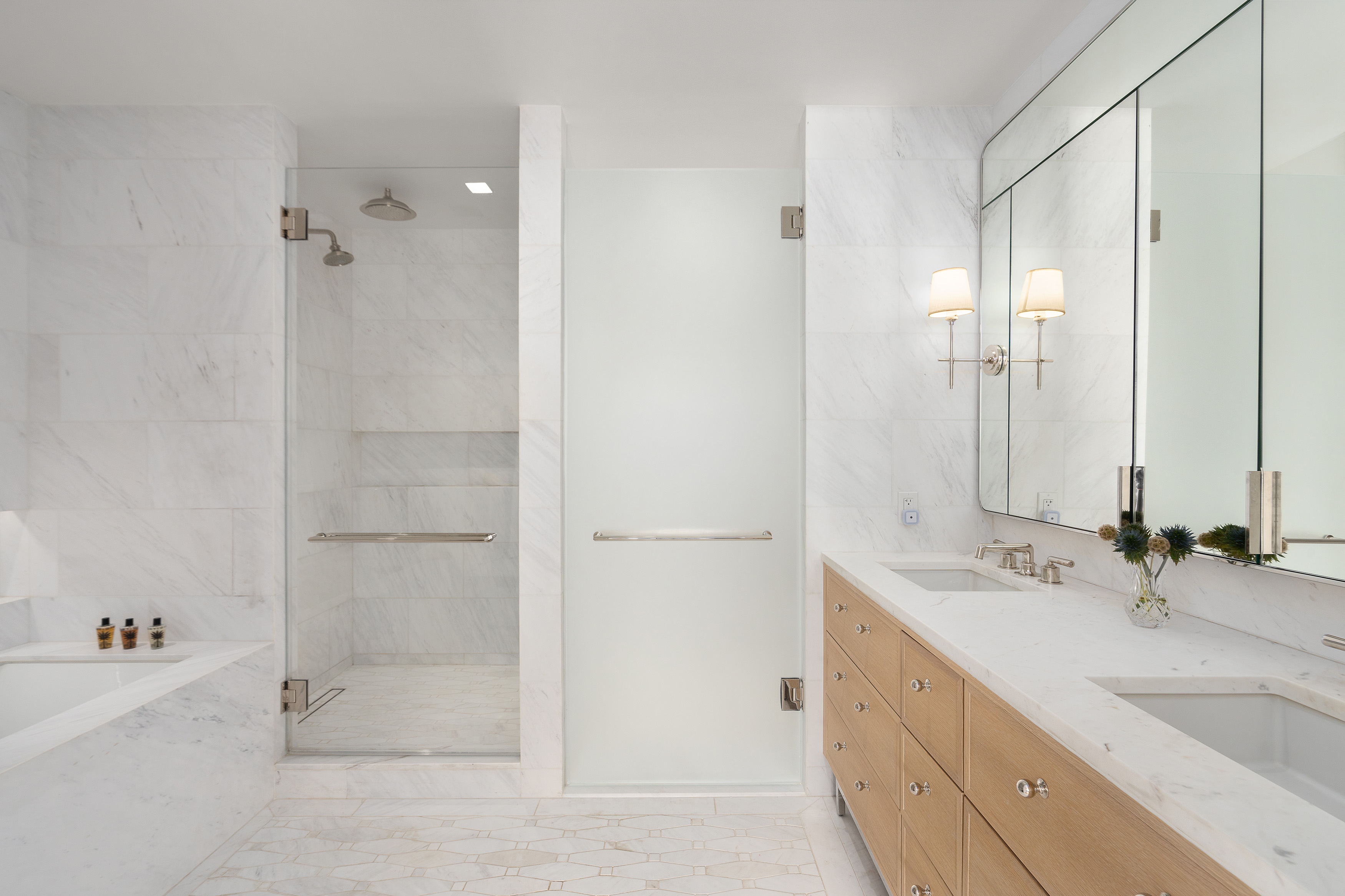 200 East 83rd Street, Unit 4E Manhattan, NY 10028 - Photo 10 of 29 a bathroom with a tub sink and mirror