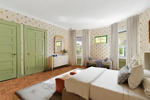 a bedroom with a bed and window