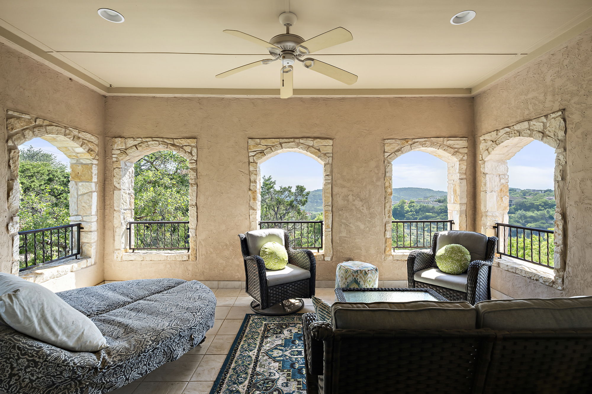 1607 The High Road Austin, TX 78746 - Photo 23 of 28 a living room with furniture and a floor to ceiling window