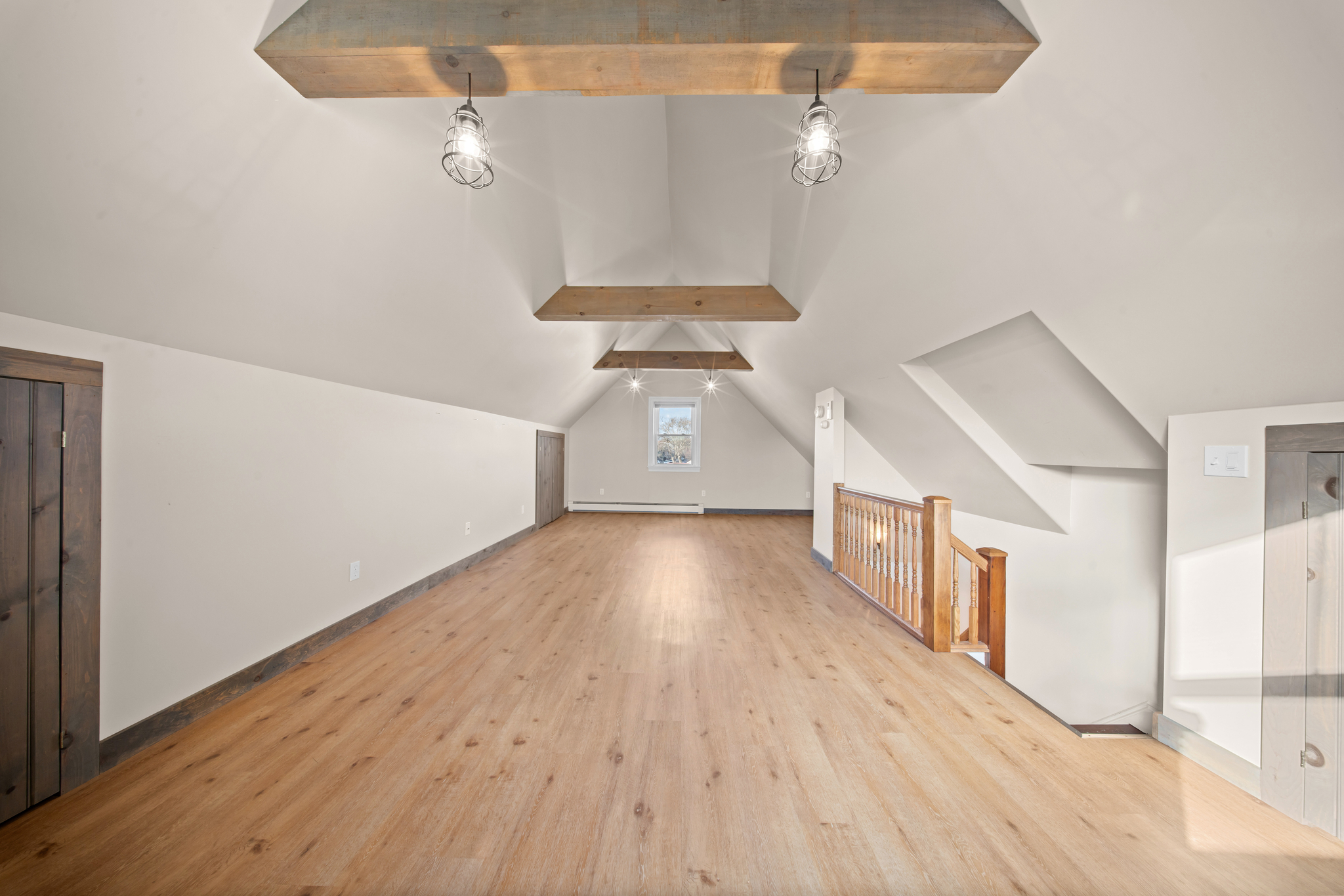 52-19 69th Street Queens, NY 11378 - Photo 25 of 35 a view of a hallway with wooden floor