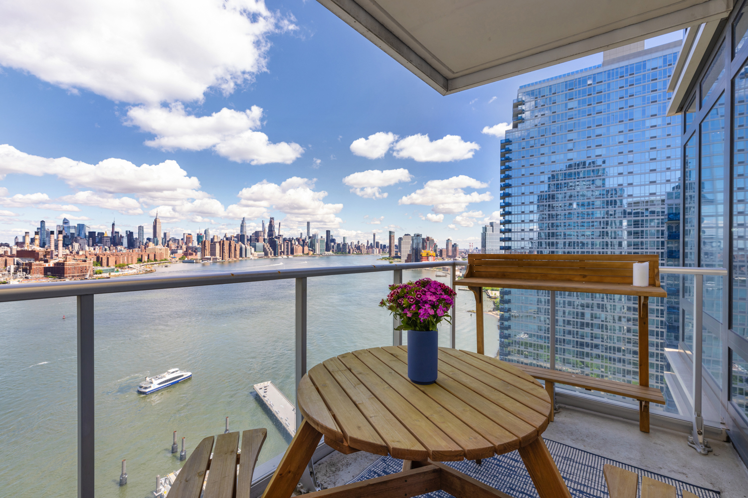 2 Northside Piers, Unit 25P Brooklyn, NY 11249 - Photo 4 of 26 a front view of a house with outdoor seating