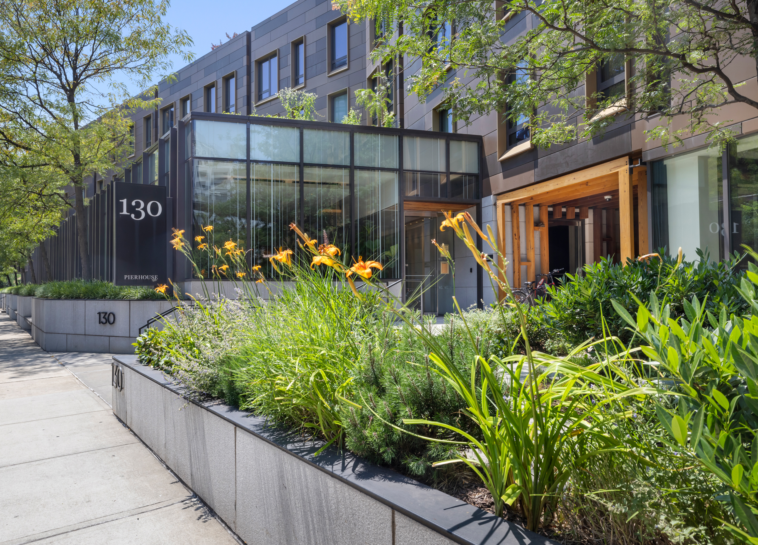 130 Furman Street, Unit S102 Brooklyn, NY 11201 - Photo 22 of 26 a view of a house with a flower garden