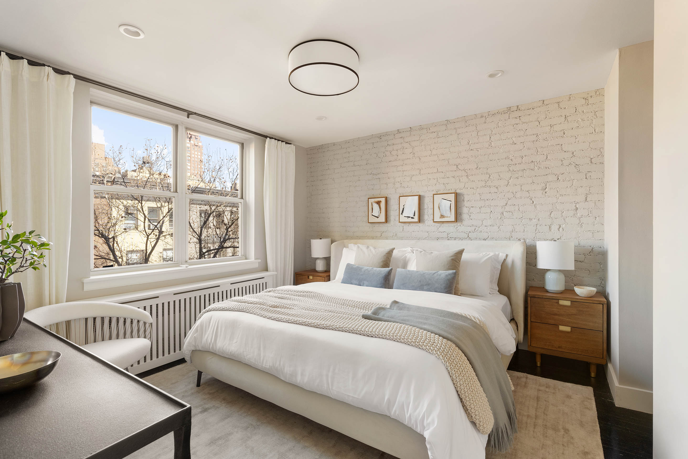 166 West 76th Street, Unit 5DE Manhattan, NY 10023 - Photo 5 of 10 a bedroom with a large bed and a window