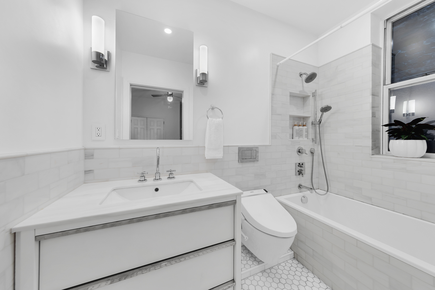 323 West 11th Street, Unit 2WE Manhattan, NY 10014 - Photo 10 of 11 a bathroom with a sink toilet and shower