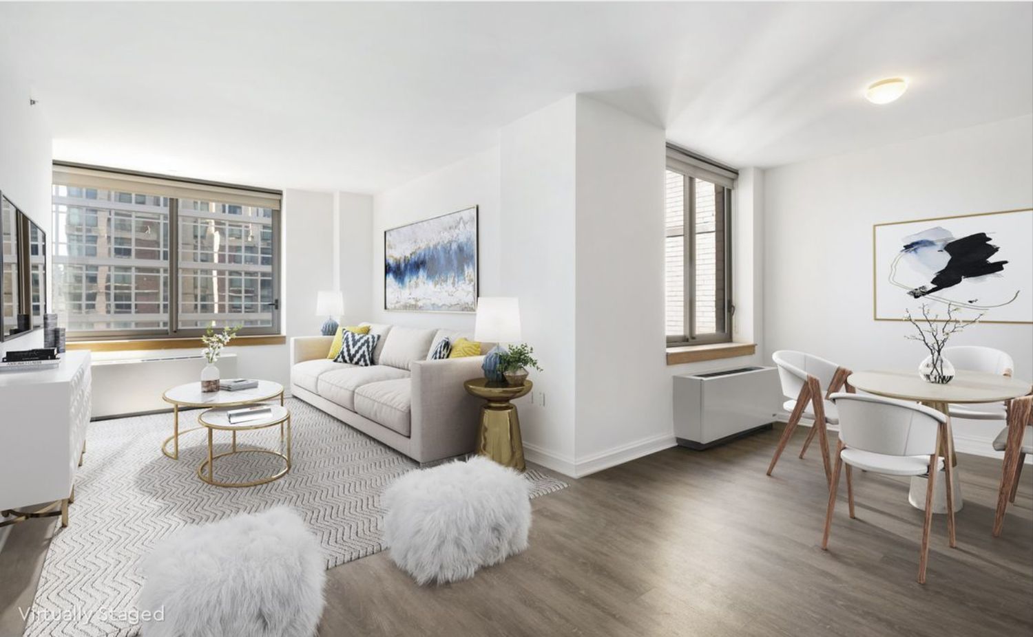 35 West 33rd Street, Unit 28D Manhattan, NY 10001 - Photo 1 of 28 a living room with furniture wooden floor and a large window