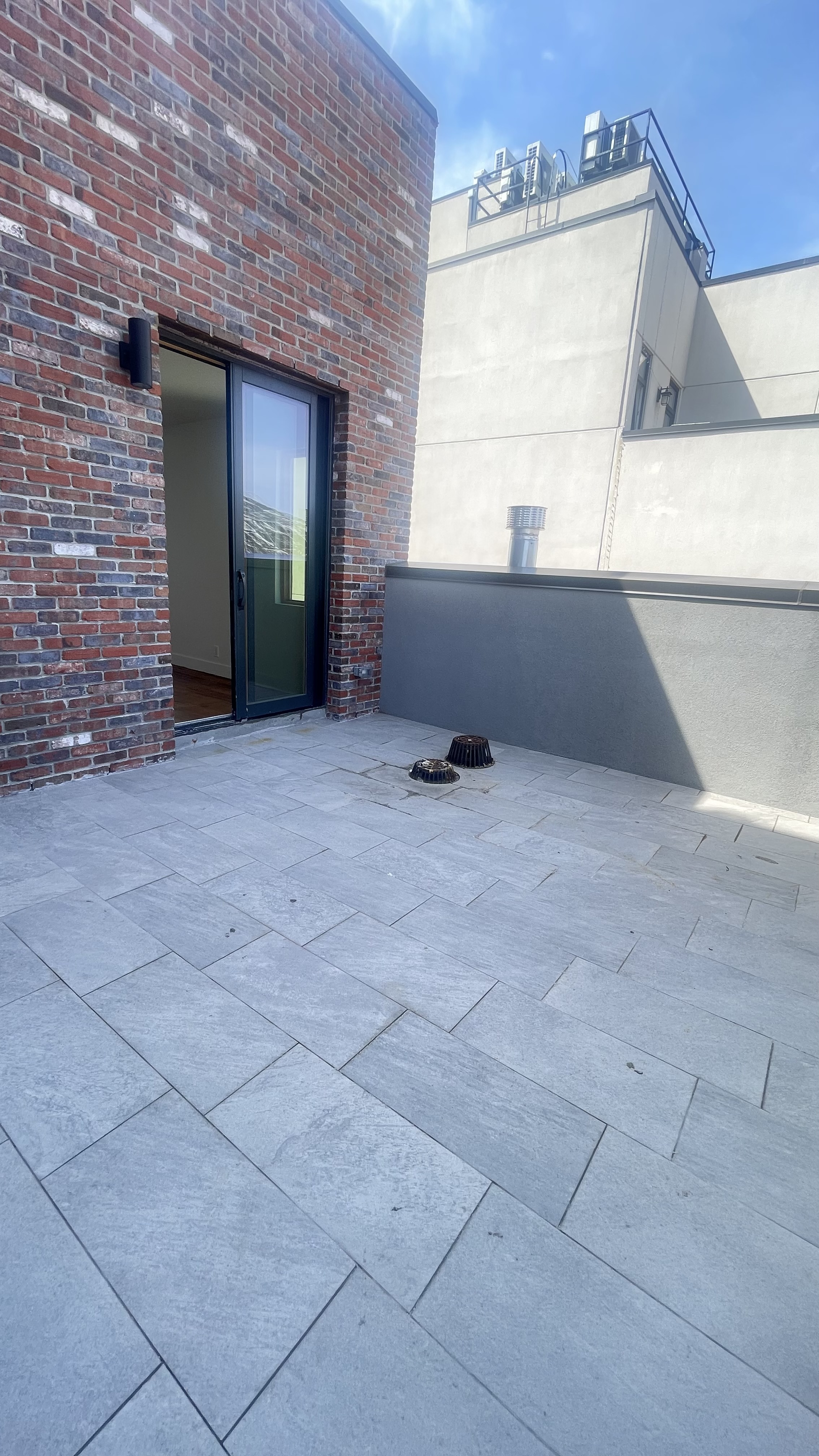 1010 Gates Avenue, Unit 6C Brooklyn, NY 11221 - Photo 9 of 9 a view of an empty room with wooden floor and a window