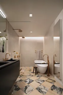 a bathroom with a granite countertop sink a toilet and a mirror