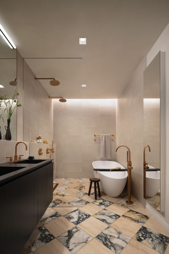 a bathroom with a granite countertop sink a toilet and a mirror