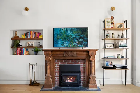 a living room with furniture and a fireplace