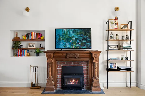 a living room with furniture and a fireplace