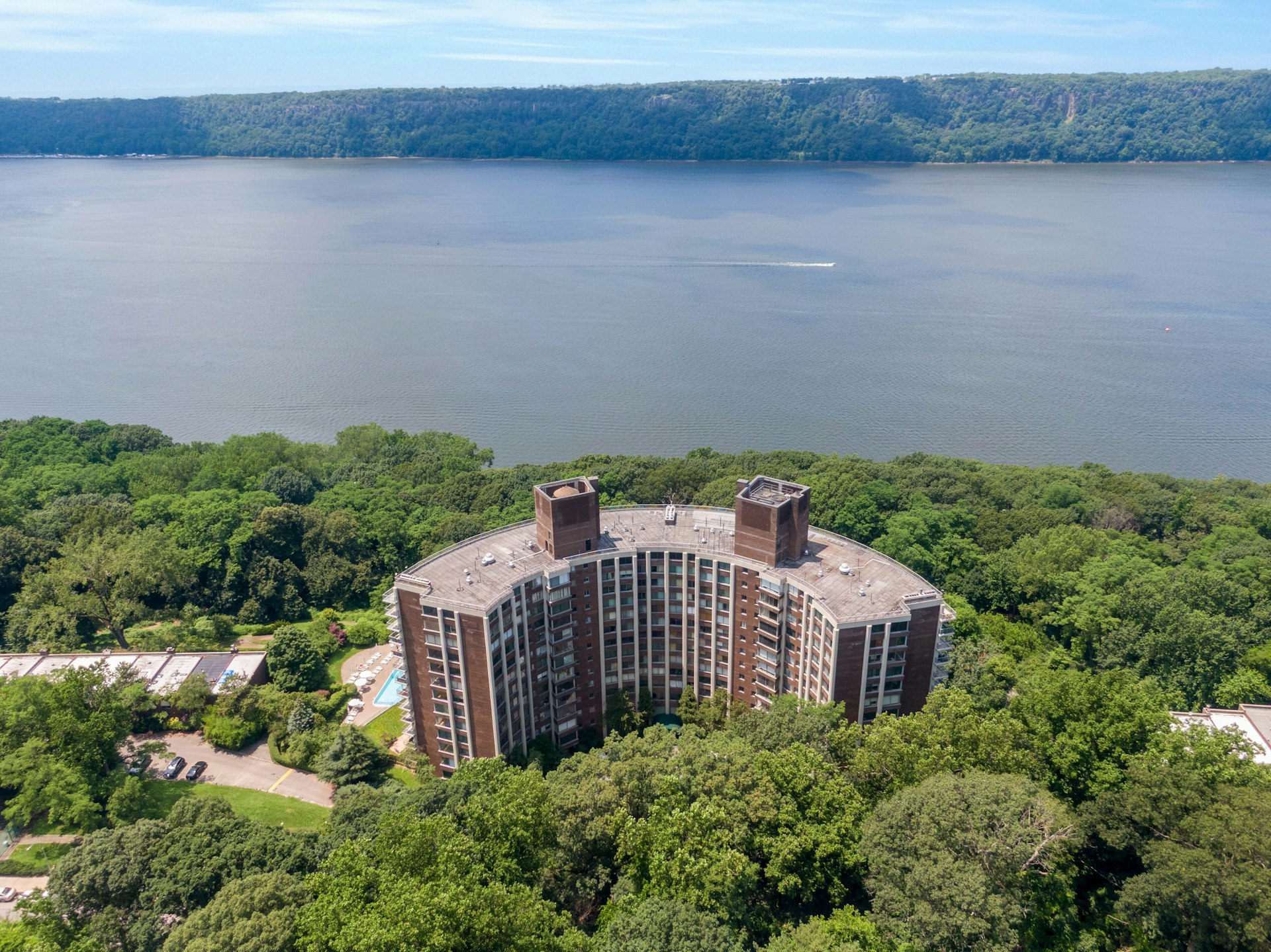 4455 Douglas Avenue, Unit 3F Bronx, NY 10471 - Photo 23 of 27 a aerial view of a house with a yard and lake view