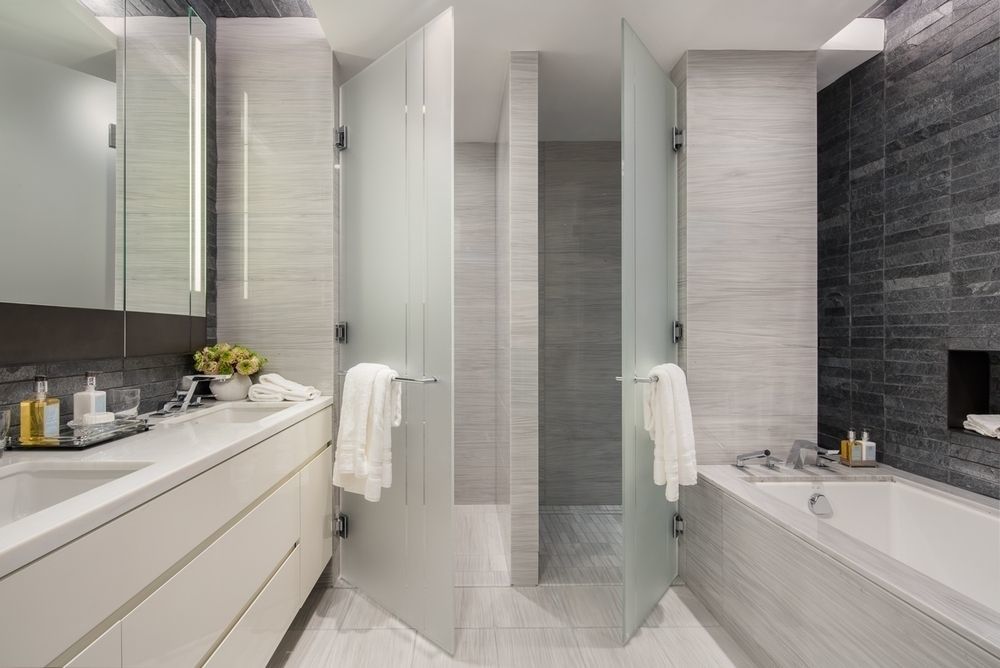 70 Charlton Street, Unit 12F Manhattan, NY 10014 - Photo 6 of 9 a bathroom with a sink a toilet and shower