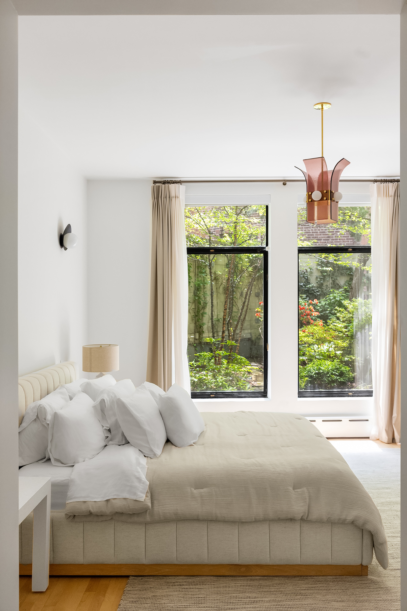 134 Charles Street Manhattan, NY 10014 - Photo 8 of 10 a bedroom with a bed and window