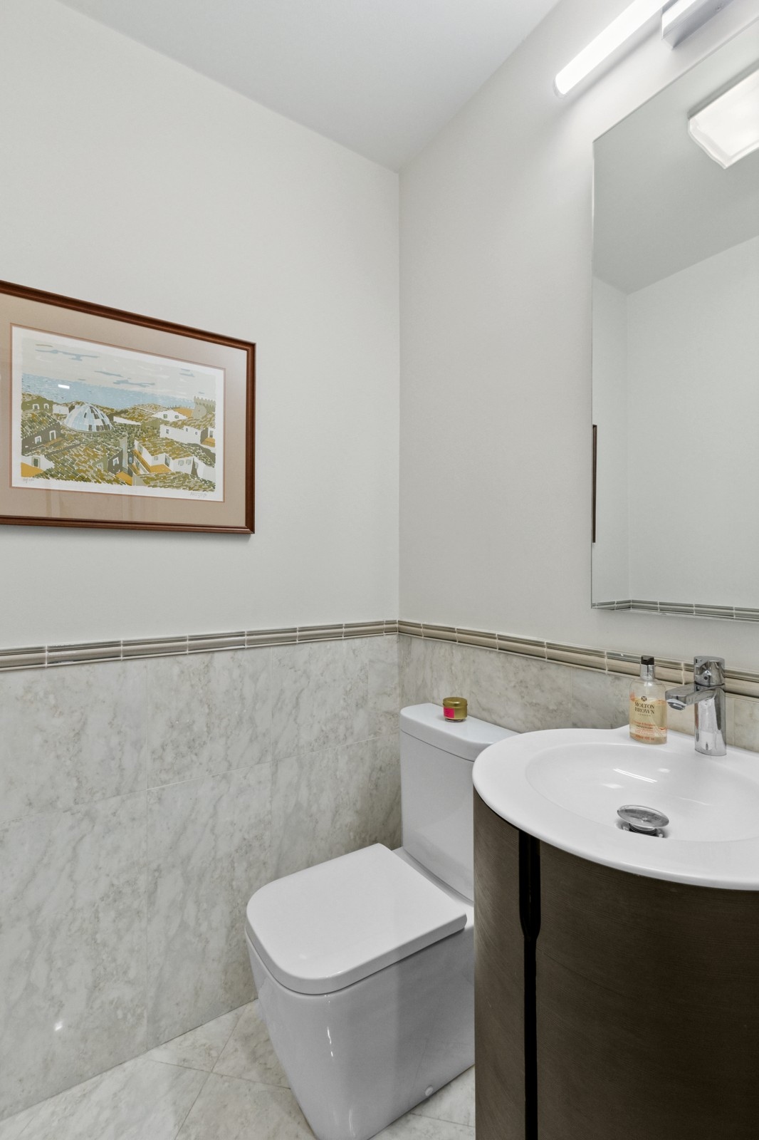 309 West 86th Street, Unit 11B Manhattan, NY 10024 - Photo 10 of 13 a bathroom with a toilet sink and mirror