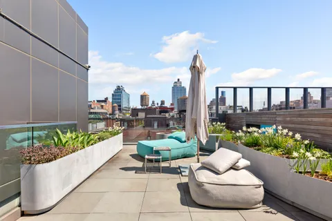 a living room filled with furniture and a garden