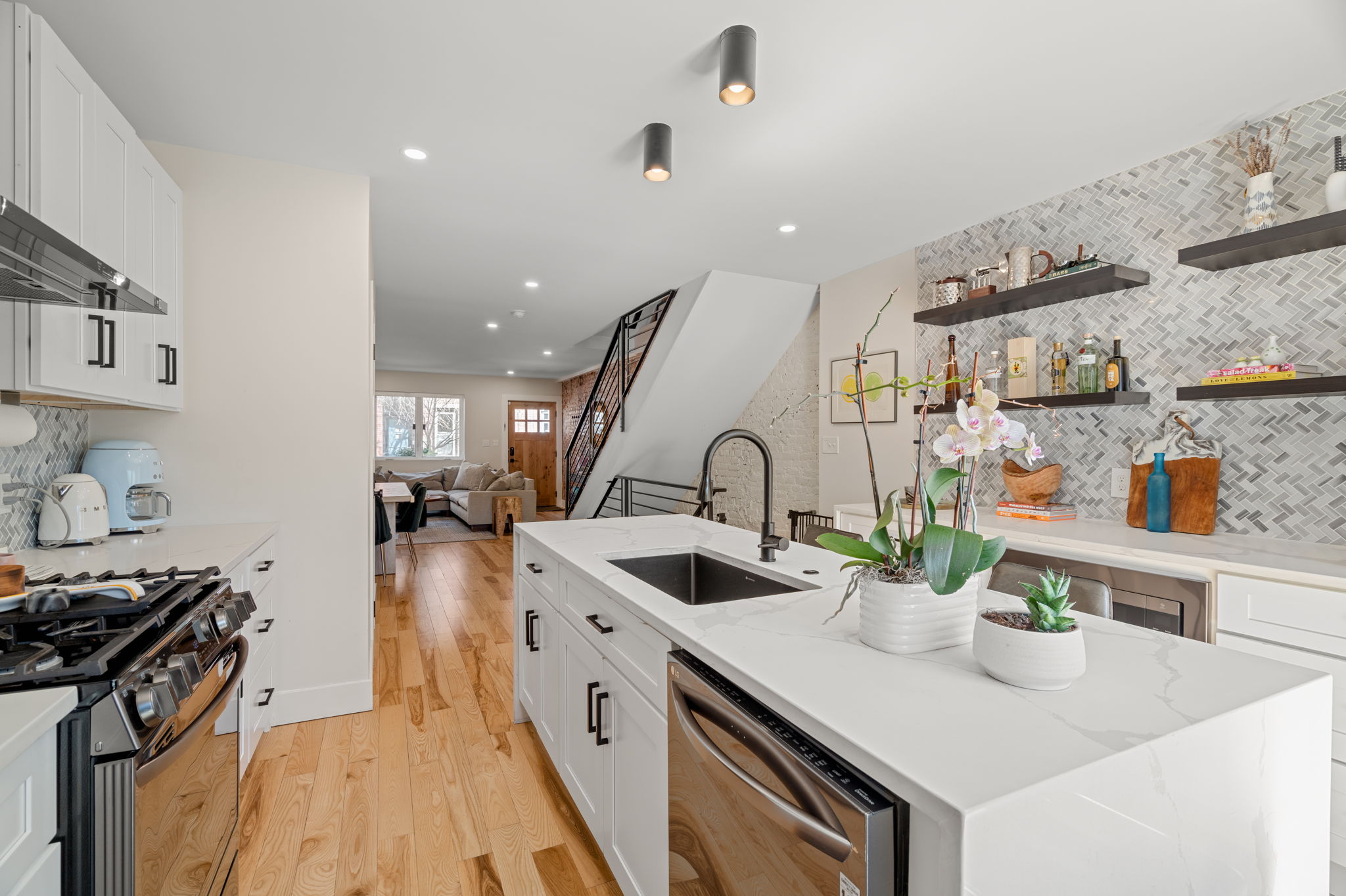 1934 Pemberton Street Philadelphia, PA 19146 - Photo 21 of 50 a kitchen with sink a stove and cabinets