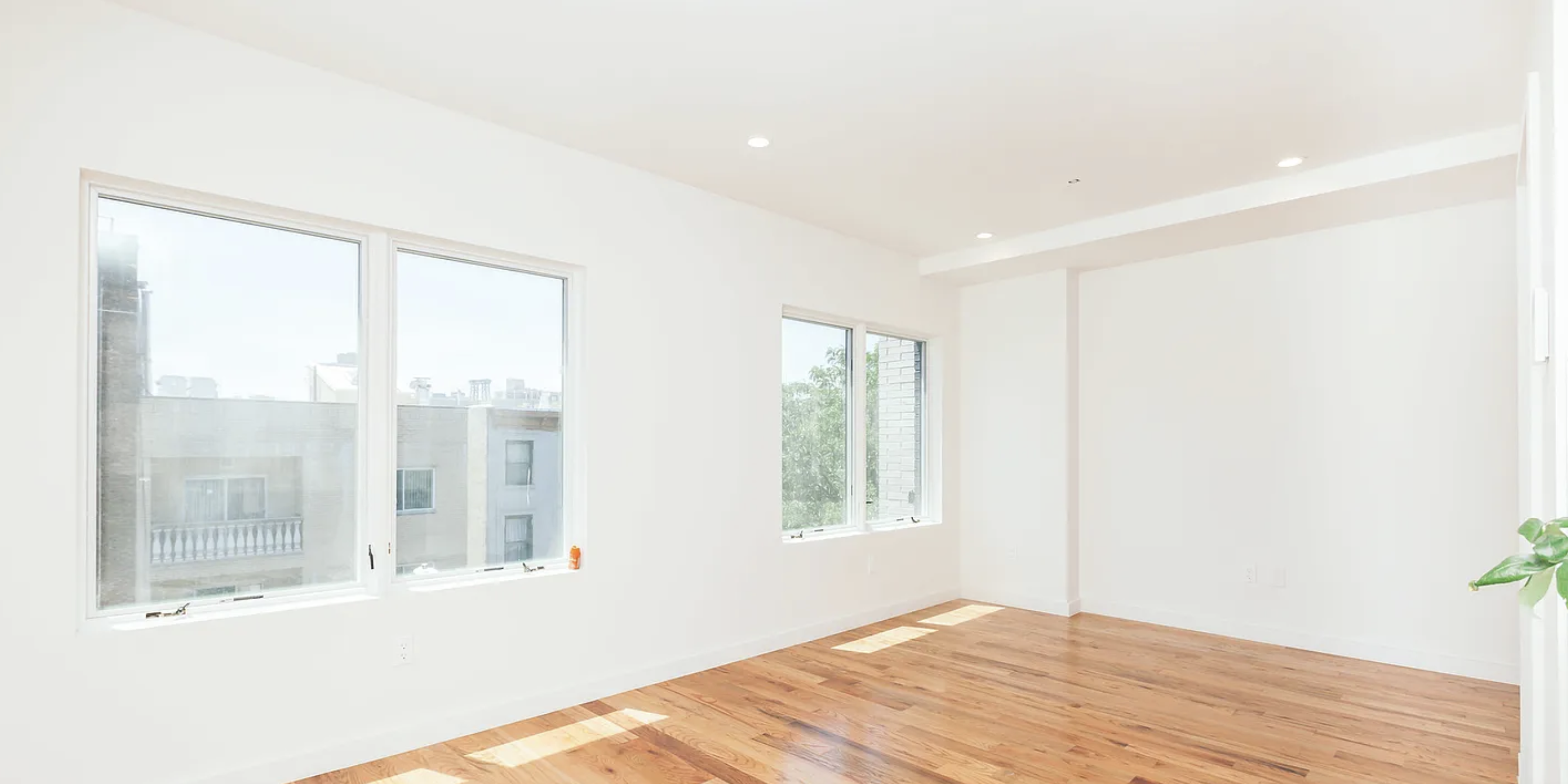 131 North 5th Street, Unit 4 Brooklyn, NY 11249 - Photo 5 of 6 a view of an empty room with wooden floor and a window