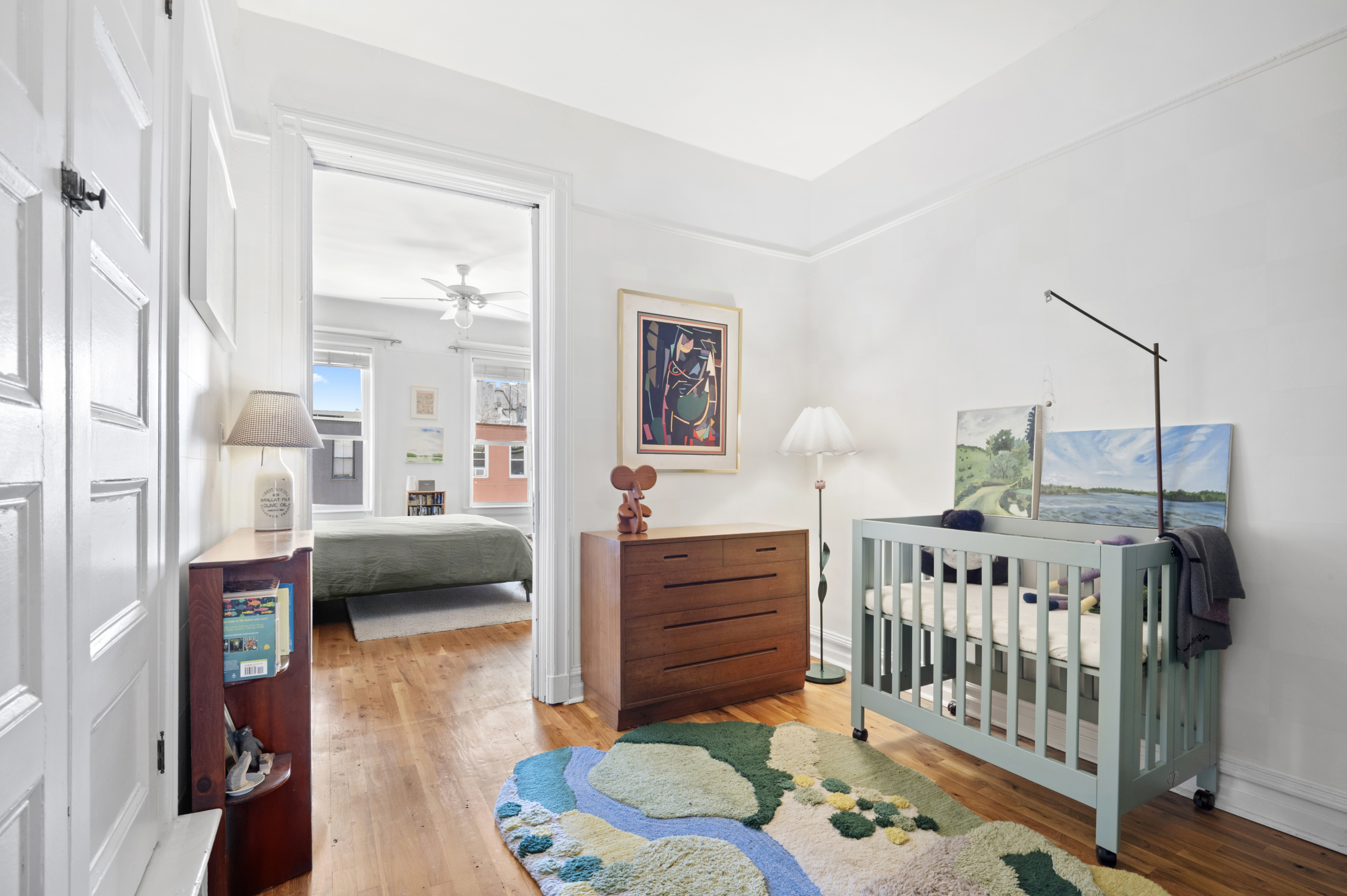 185 East 31st Street Brooklyn, NY 11226 - Photo 19 of 23 a bedroom with furniture and a wooden floor